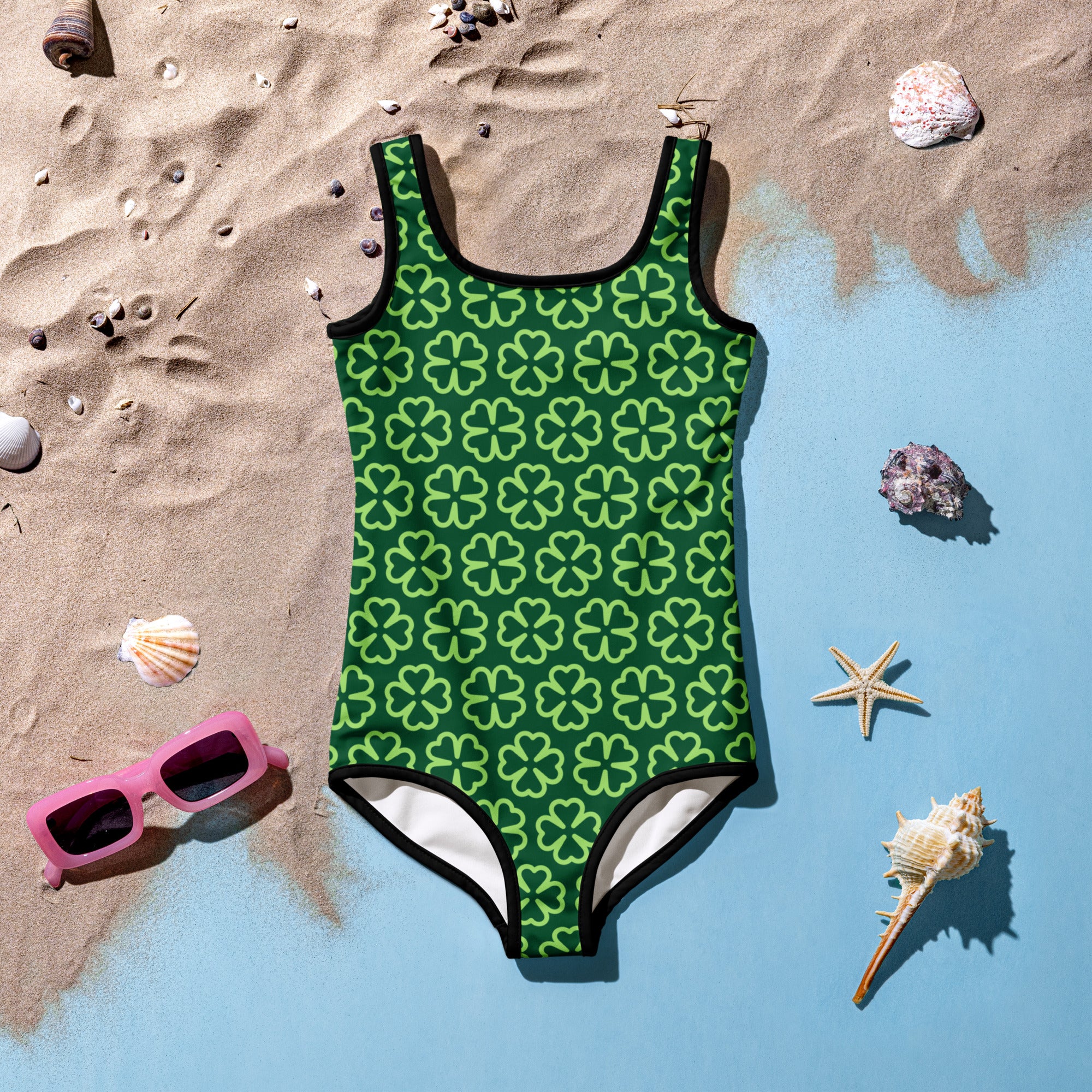 Girls dark green shamrock buttery soft swimsuit with light green four-leaf clovers black trim and upf 50 plus protection