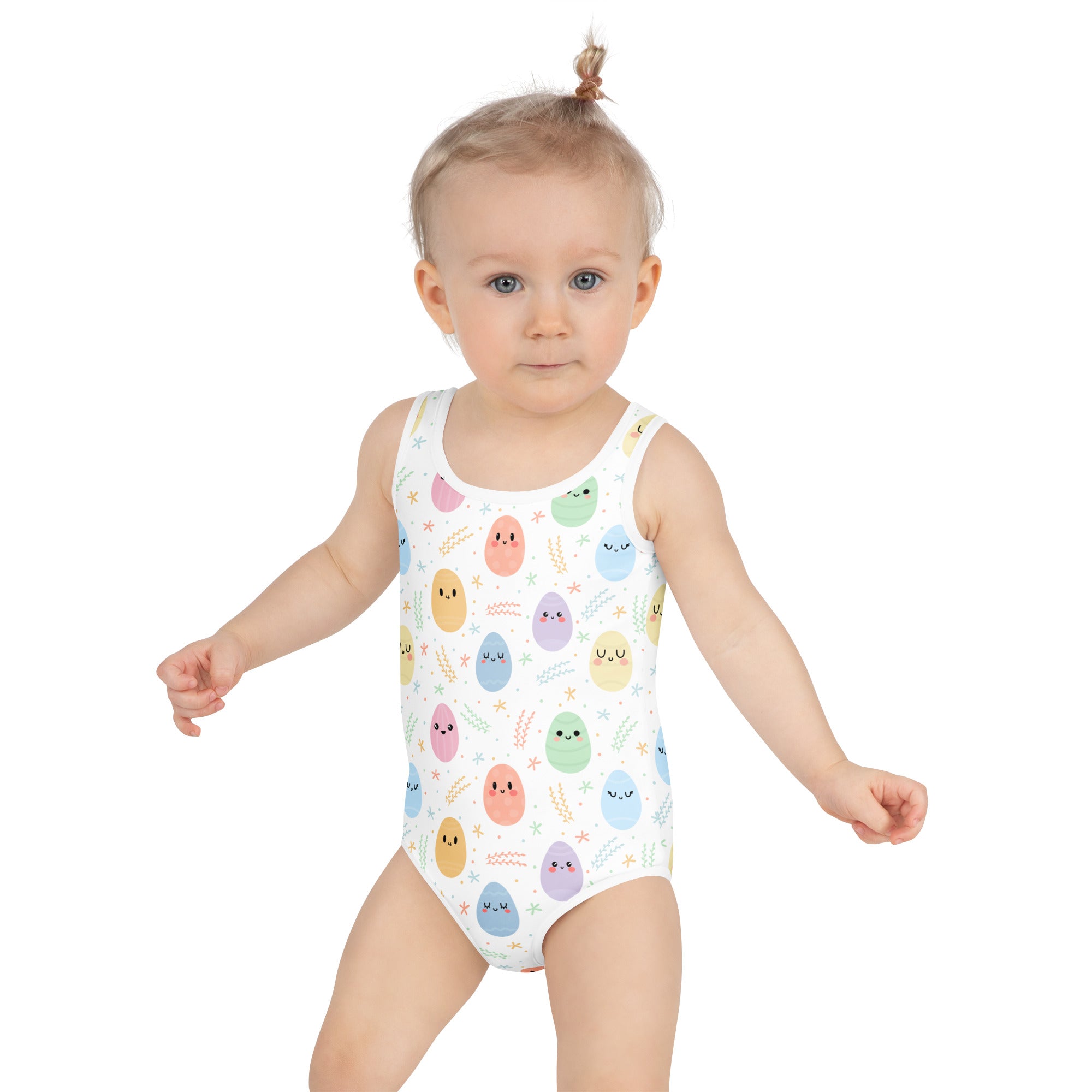 White one-piece girls swimsuit with colorful pastel egg faces buttery soft fabric upf 50 plus double layered front