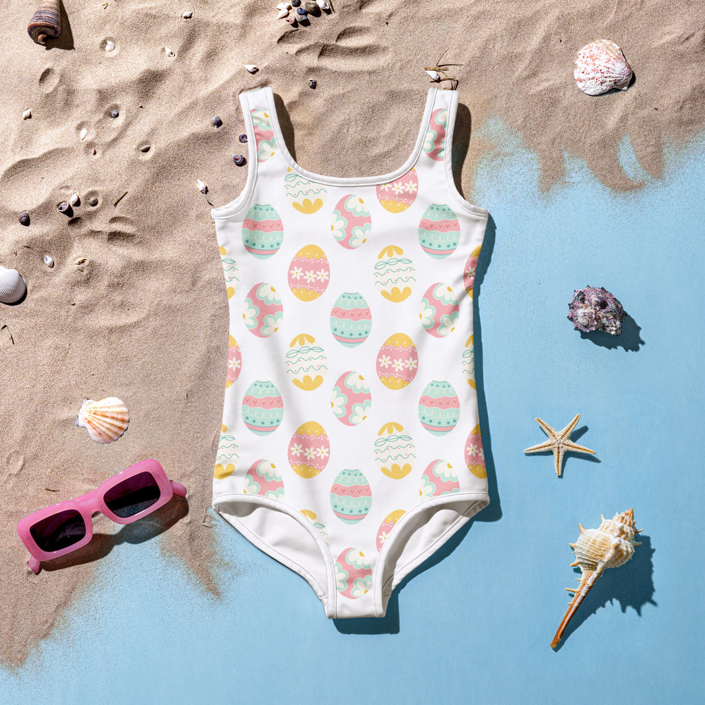Girls pastel easter eggs buttery soft white swimsuit with pink yellow mint egg pattern upf 50 plus double layered front