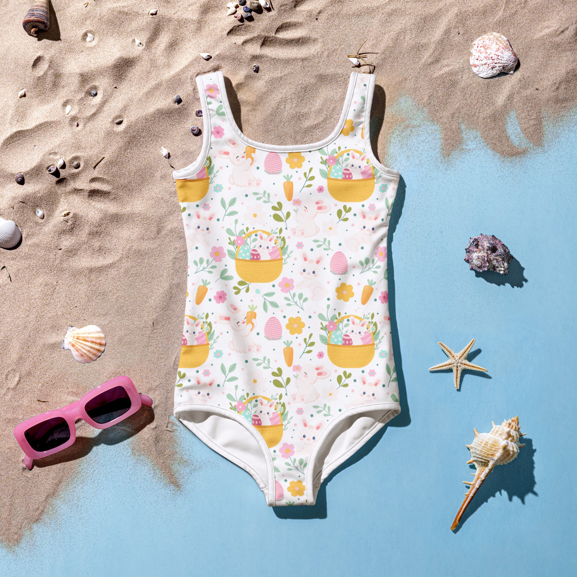 White one-piece girls swimsuit with playful easter bunny basket pattern buttery soft fabric upf 50 plus double layered front