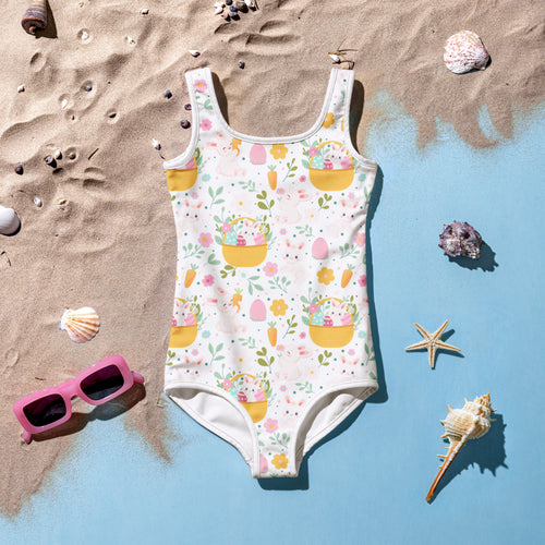 White one-piece girls swimsuit with playful easter bunny basket pattern buttery soft fabric upf 50 plus double layered front