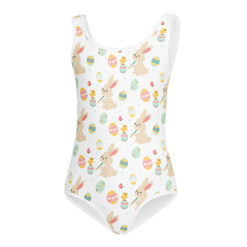 White one-piece swimsuit with playful easter pattern of beige bunnies colorful eggs and yellow chicks for girls dance