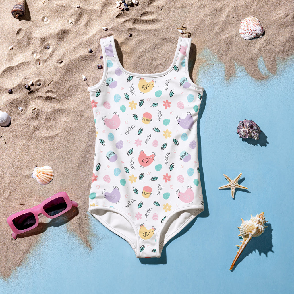 White one-piece girls swimsuit with pastel chick pattern buttery soft double layered front and upf 50 plus protection