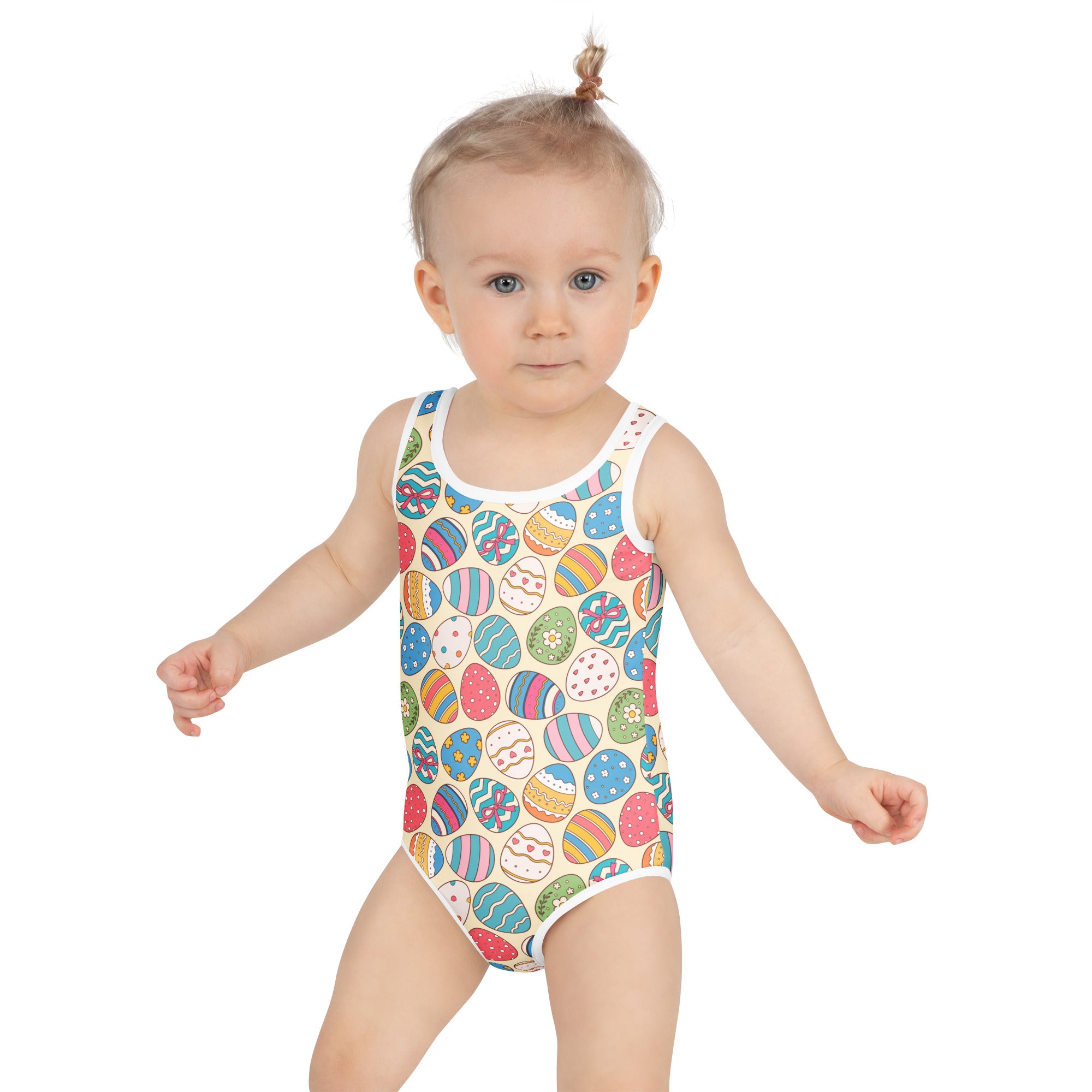 A child wearing a girls colorful easter eggs pattern buttery soft swimsuit with upf 50 and double layered front