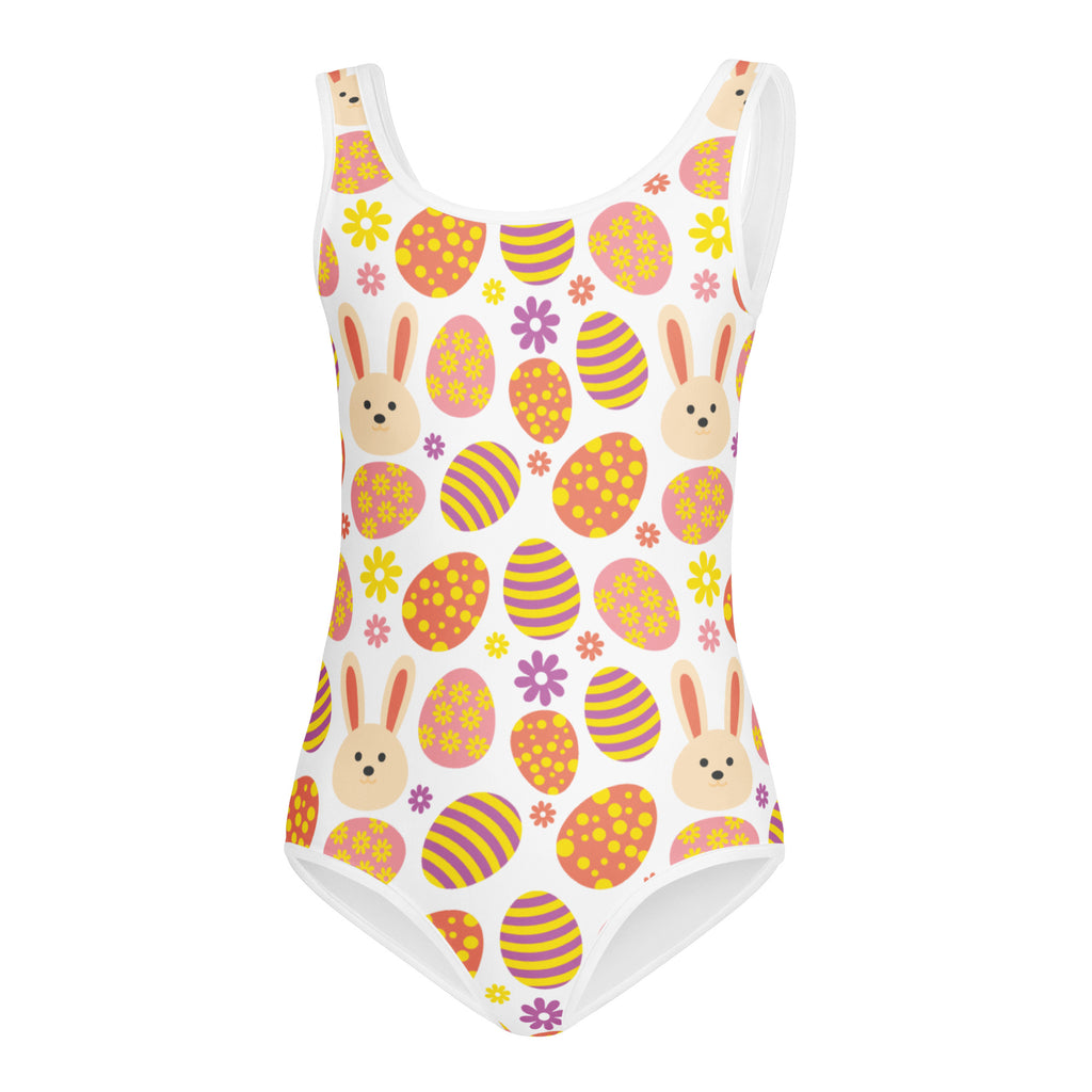 A white buttery soft girls one-piece swimsuit with playful bunny and colorful Easter egg pattern for dance and gymnastics