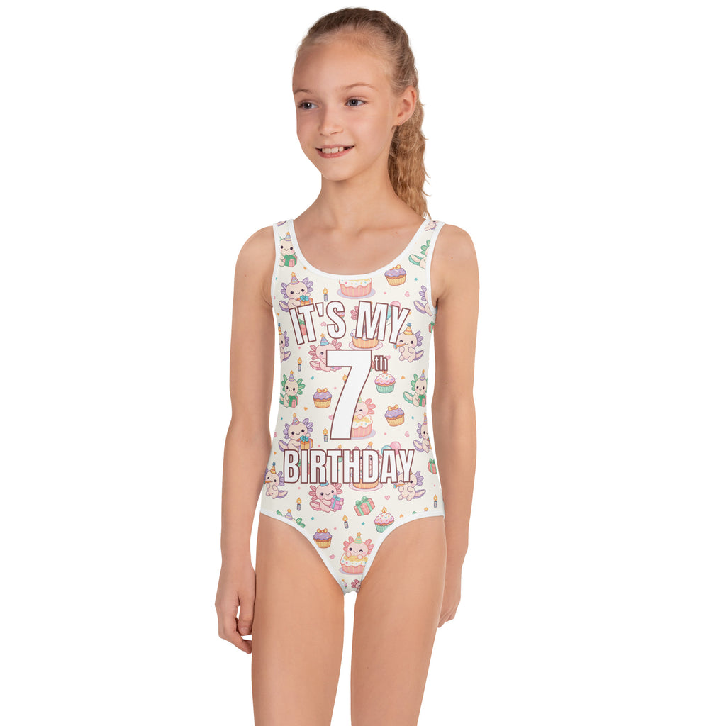 Girl wearing a swimsuit with 'It's My 7th Birthday' text and cartoon designs on a white background