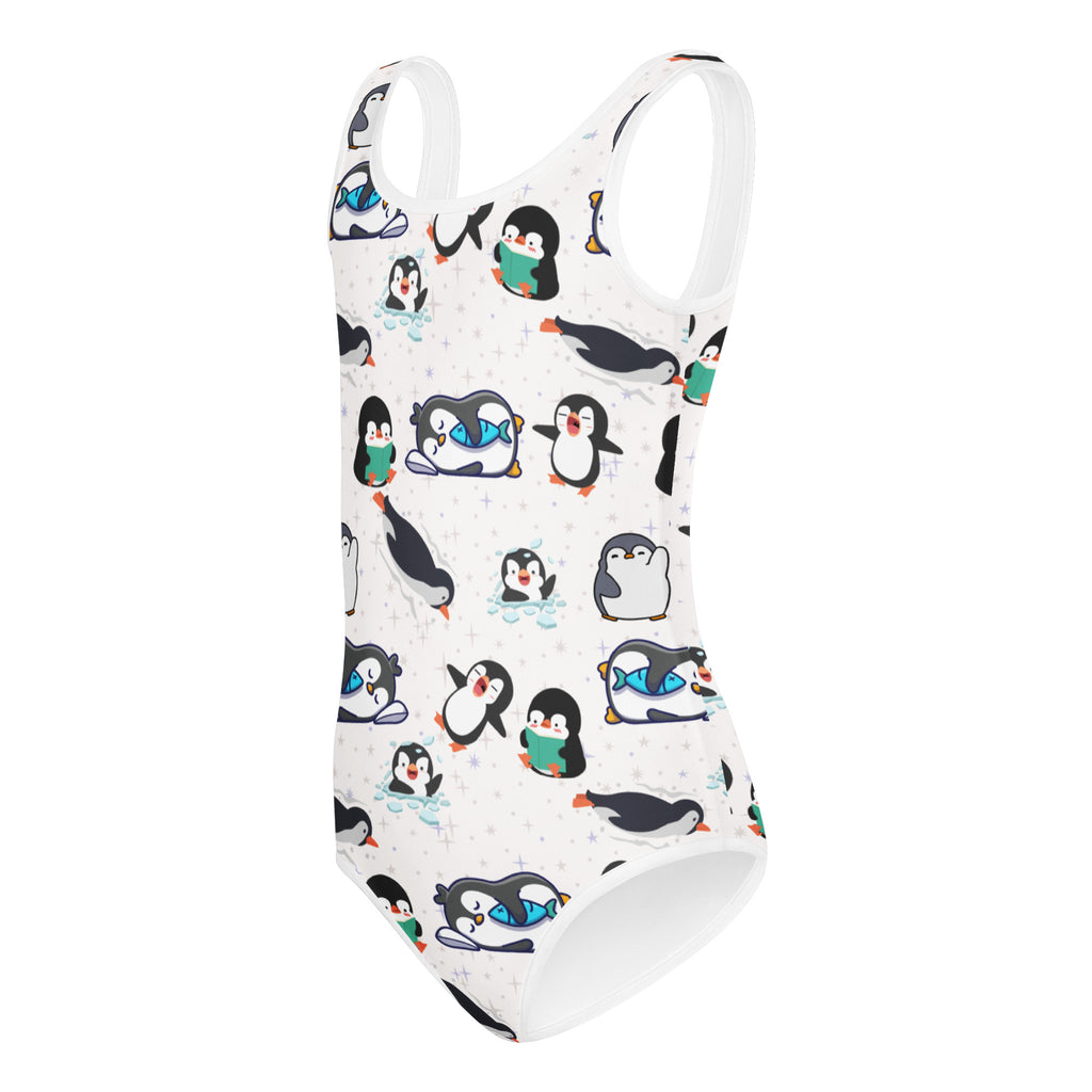 White one-piece swimsuit with playful cartoon penguin pattern and green cups for girls winter dance and gymnastics