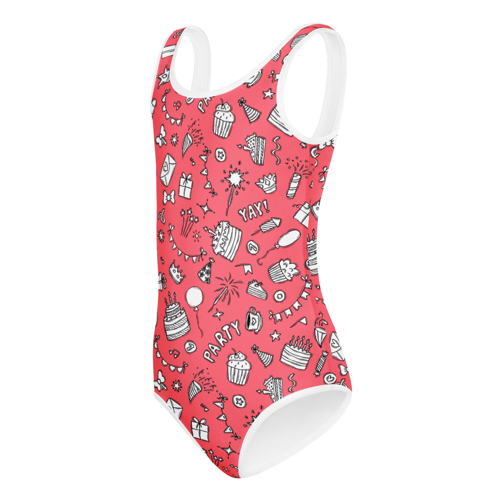 Girls pink birthday party buttery soft coral swimsuit with white trim and playful cupcake balloon pattern for dance and gymnastics