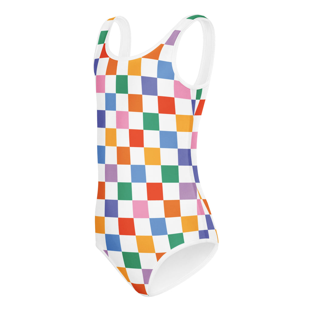 A vibrant rainbow checkered one-piece girls leotard with white straps, buttery soft and quick drying for dance and gymnastics