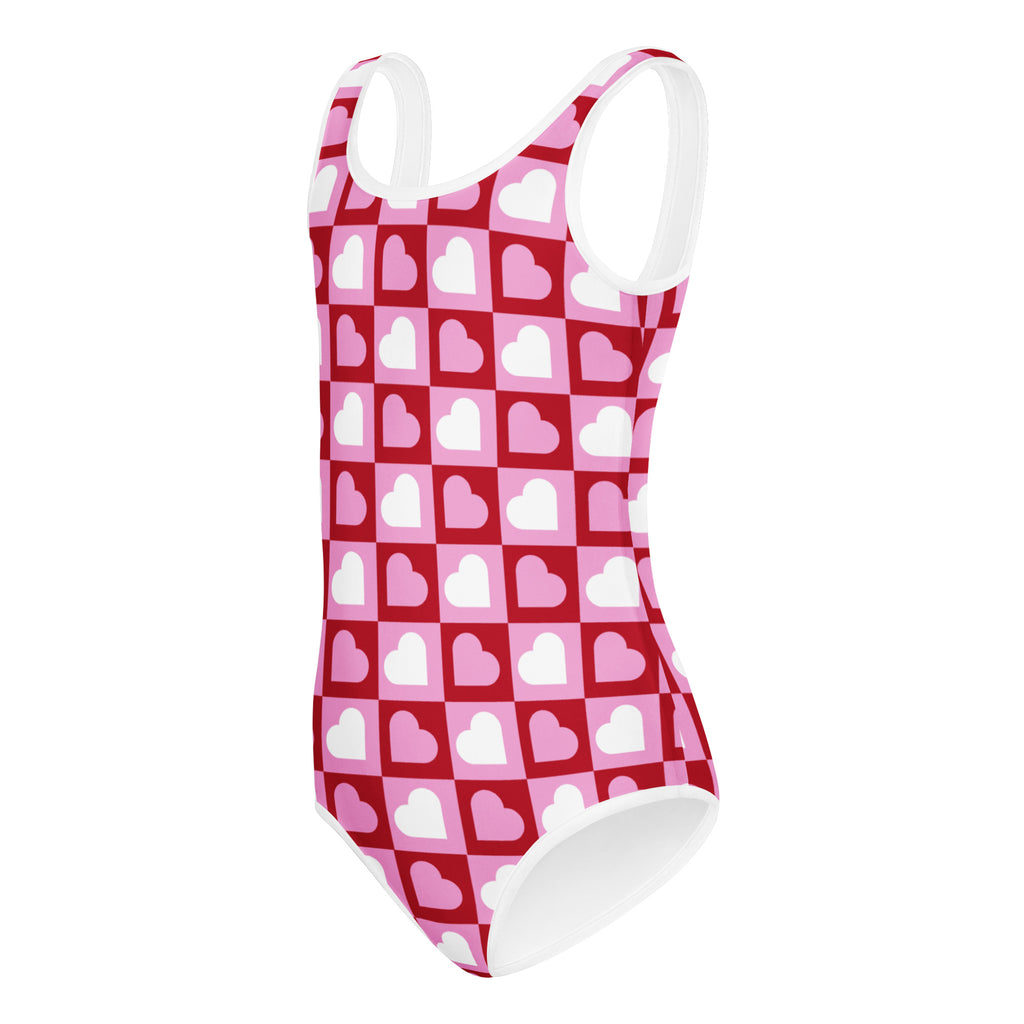 Girls Valentine’s Day quick drying one-piece leotard with pink and red heart pattern and white trim for dance and gymnastics