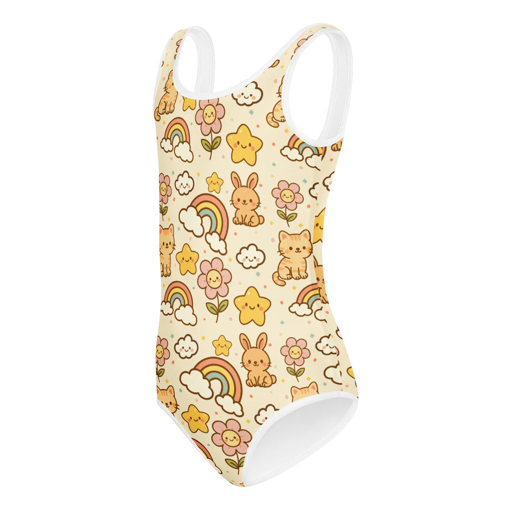 A cream-colored buttery soft girls leotard with cartoon bunnies cats rainbows and flowers for dance and gymnastics