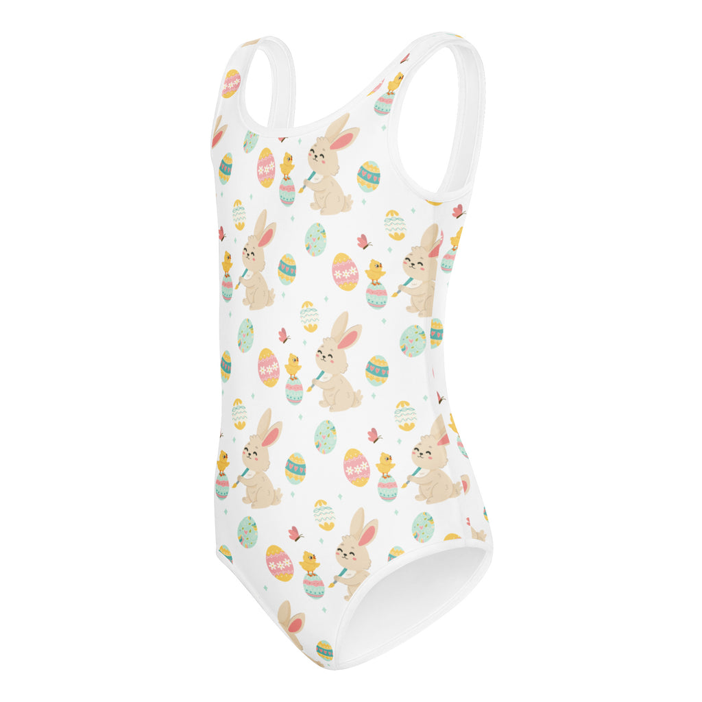 White one-piece swimsuit with playful easter-themed bunnies chicks and eggs in pastel hues buttery soft quick drying