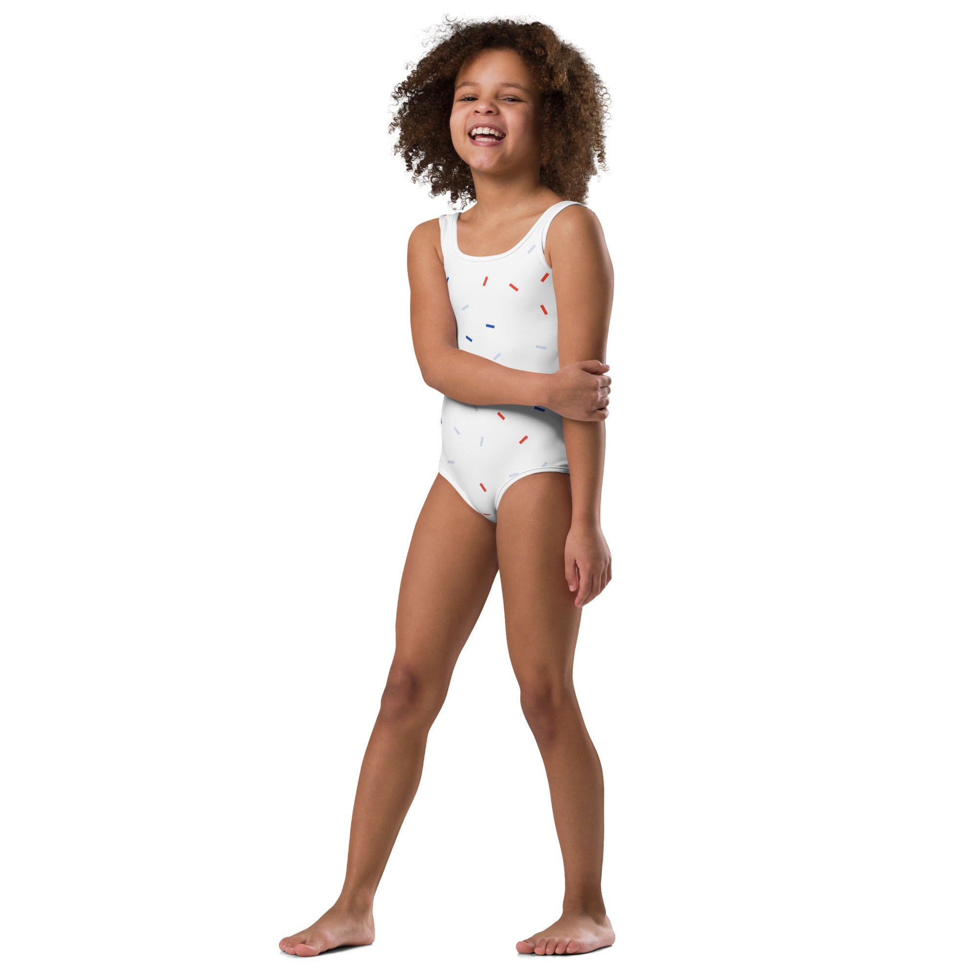 White one-piece swimsuit for girls with red and blue sprinkle pattern perfect for 4th of july celebrations