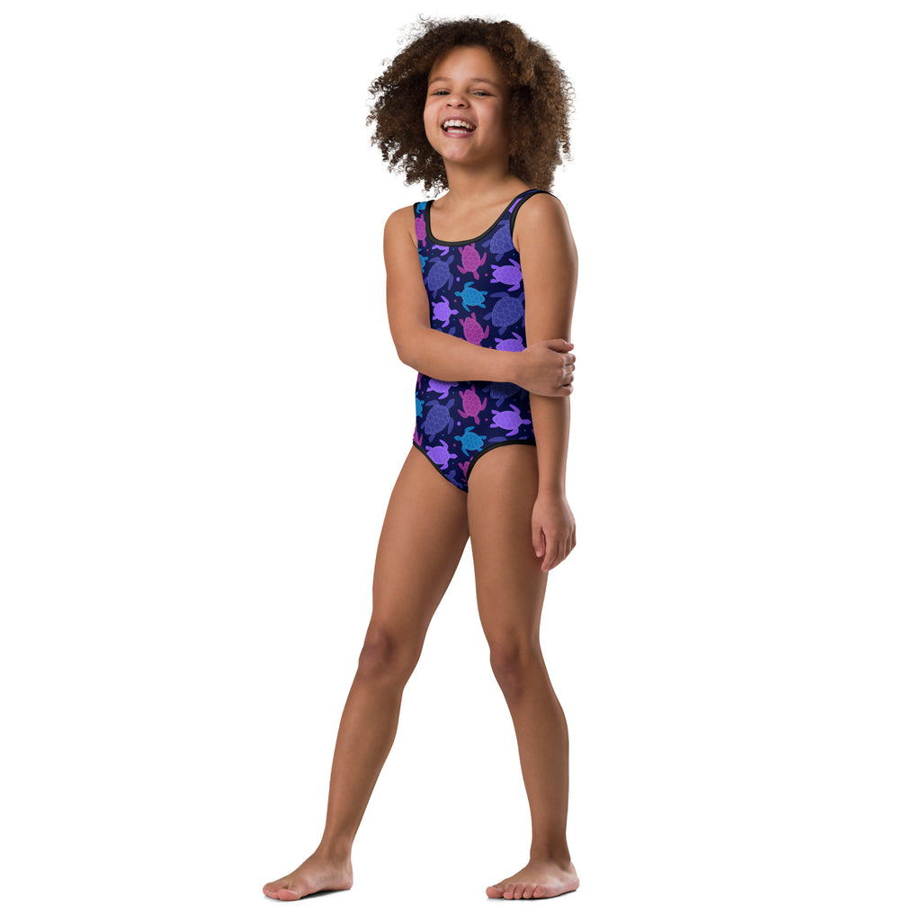 Girls purple sea turtle buttery soft quick drying swimsuit with playful purple and teal turtle pattern on navy background