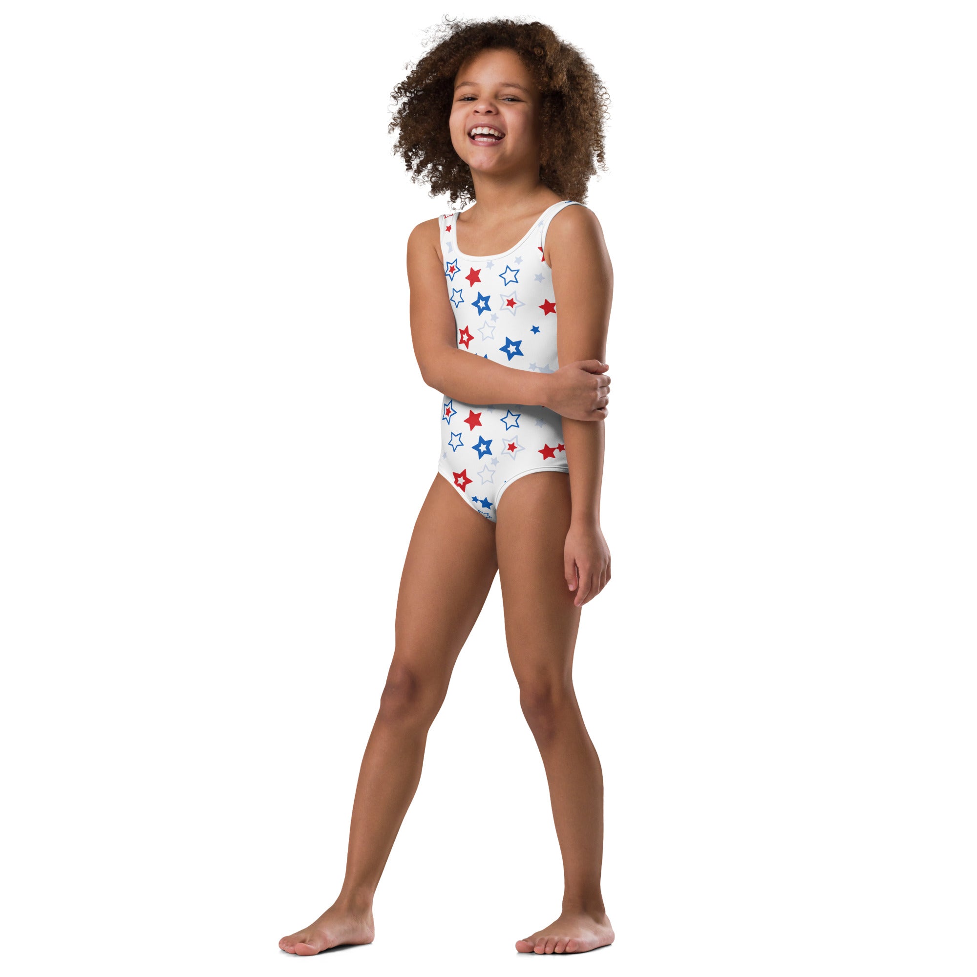 White one-piece swimsuit with red and blue star patterns in buttery soft fabric for dance and gymnastics use