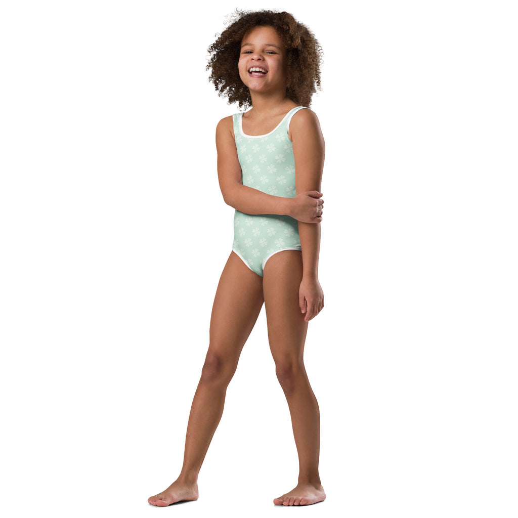 Girls pastel shamrock buttery soft mint green one-piece swimsuit with white trim and subtle star pattern for dance and gymnastics