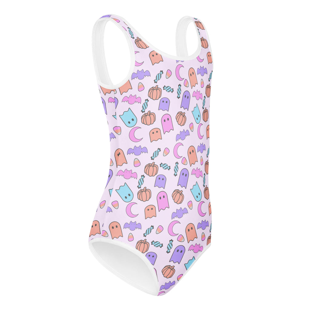 White buttery soft one-piece swimsuit with pastel halloween ghosts bats pumpkins and candy for girls dance and gymnastics