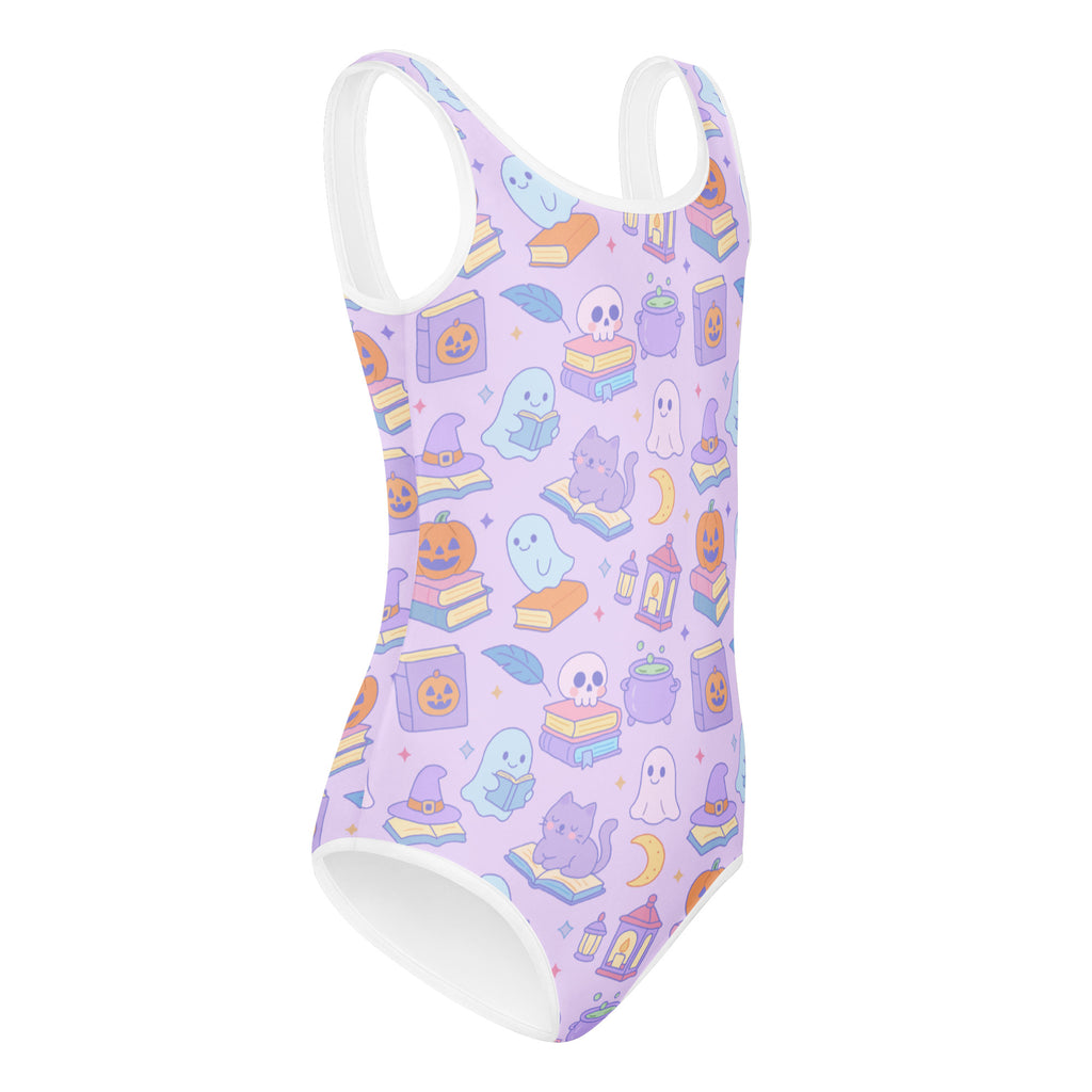 Lavender girls buttery soft one-piece swimsuit with white trim and halloween ghosts pumpkins and books pattern