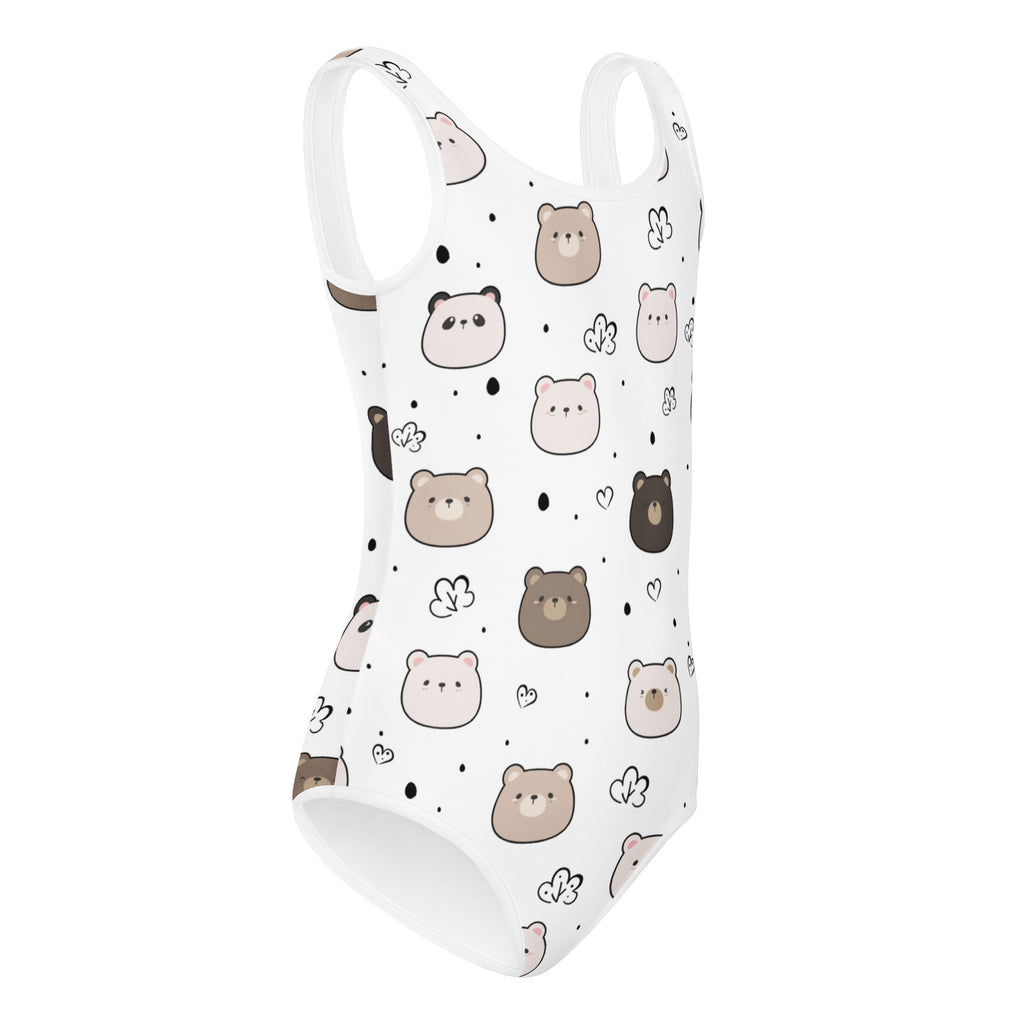 White one-piece swimsuit with playful cartoon bears pattern in brown and beige accented with black hearts and dots