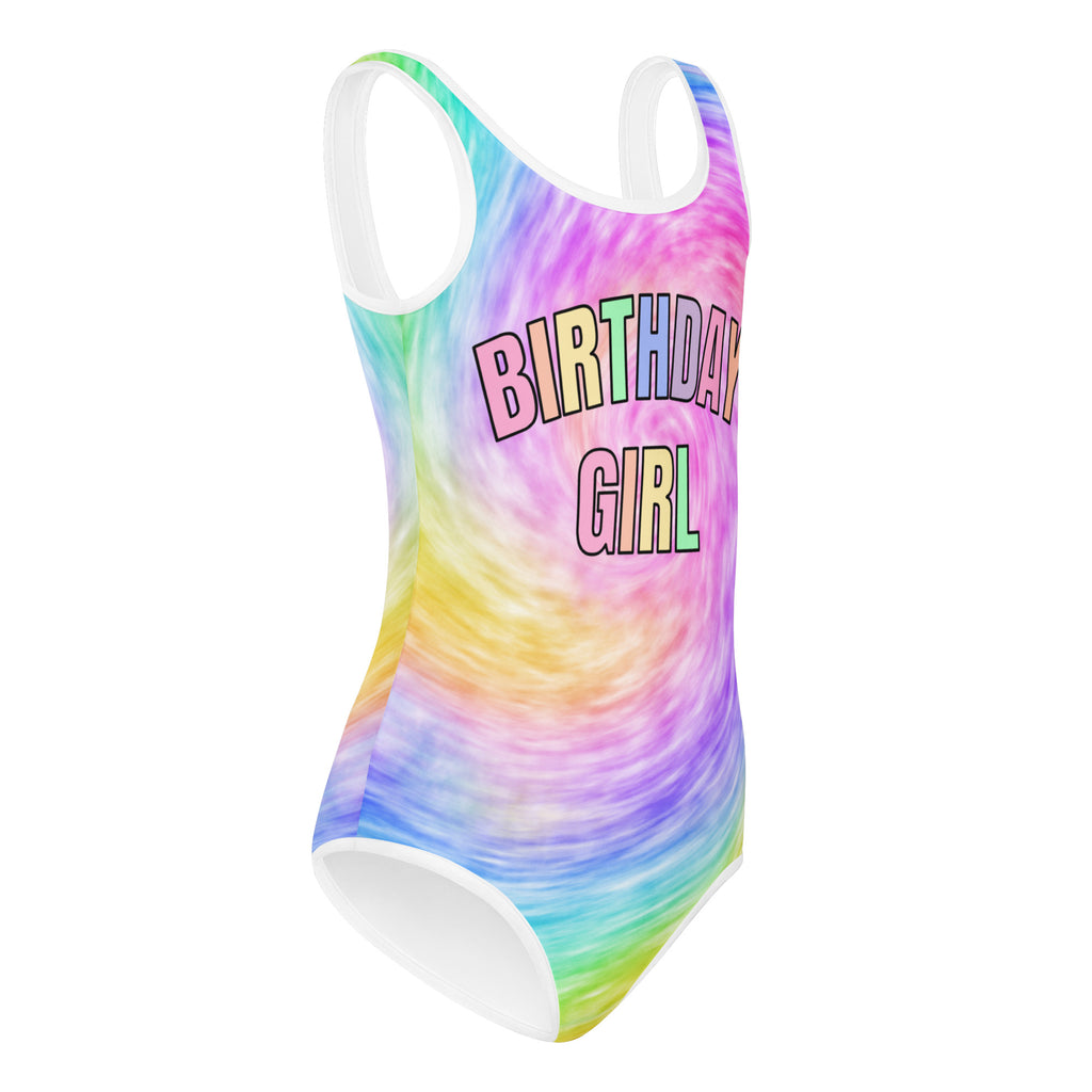 A vibrant rainbow tie dye birthday girl buttery soft leotard with white trim quick drying for dance and gymnastics