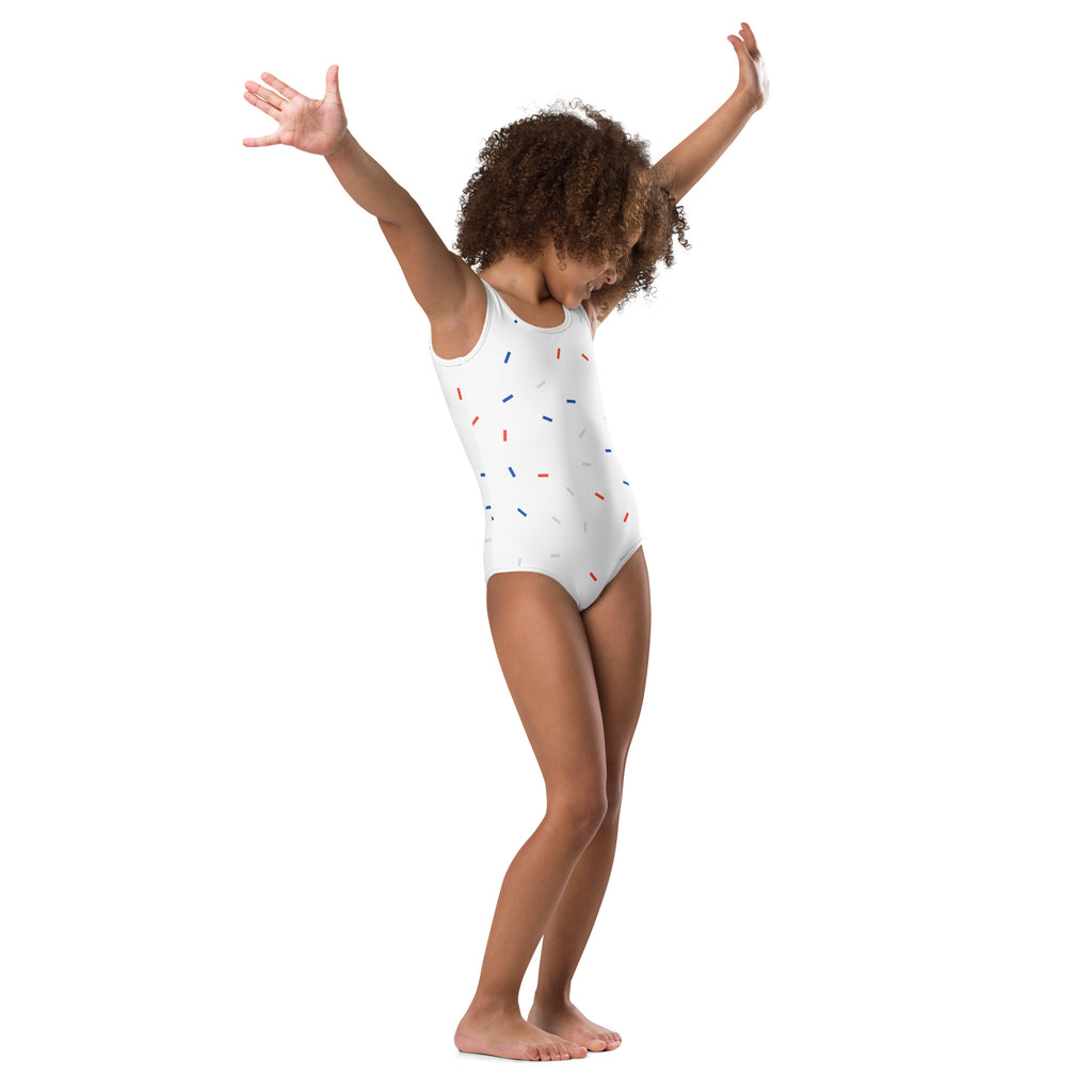 White girls one-piece leotard swimsuit with red blue and silver sprinkles for 4th of July celebration