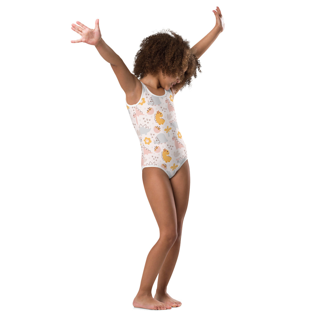 Girls pastel floral dinosaur buttery soft one-piece swimsuit in white with yellow and pink cartoon dinosaurs for quick drying