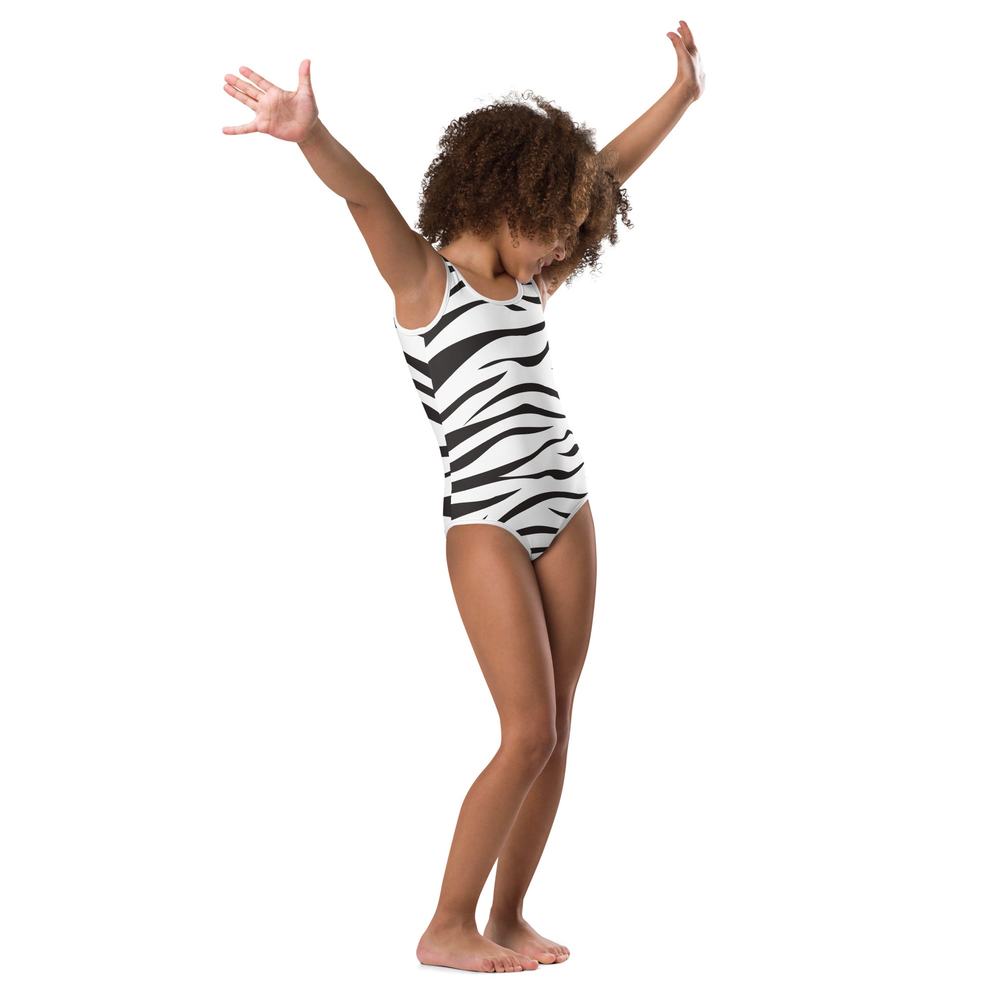 A child wearing a black and white zebra stripes buttery soft quick drying leotard for dance and gymnastics