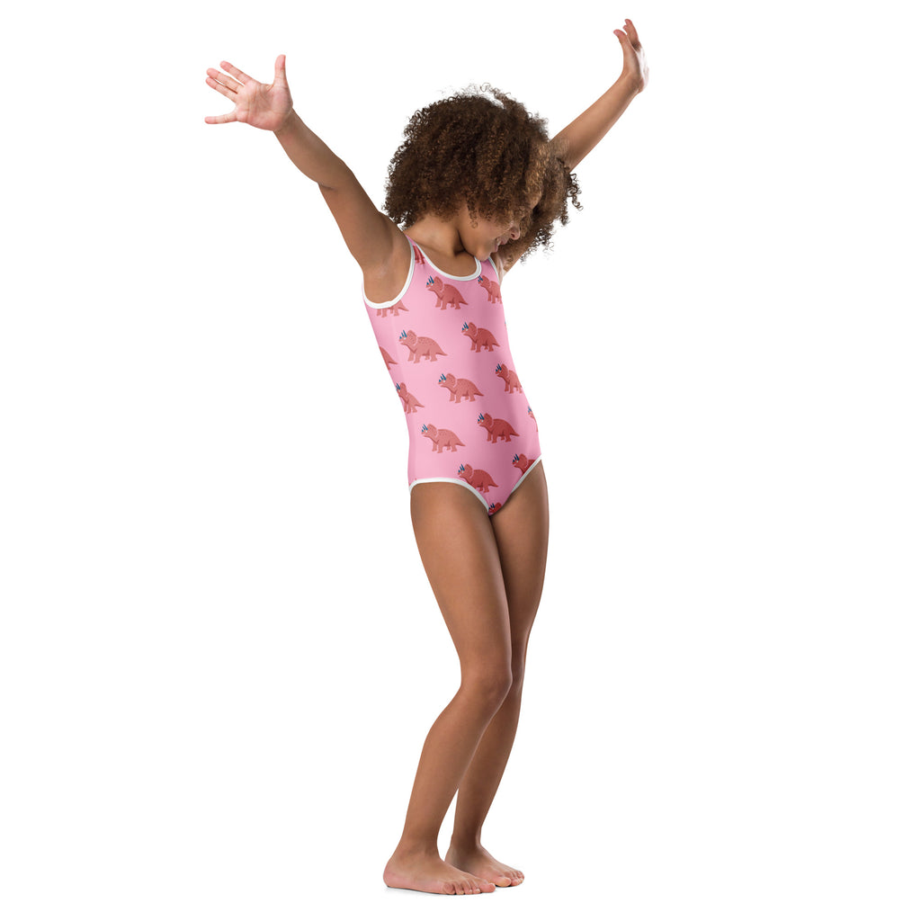Girls pink triceratops buttery soft leotard with white trim and quick drying fabric for dance and gymnastics