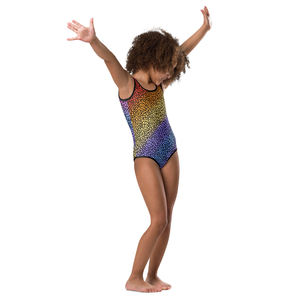 A vibrant rainbow-colored girls leotard with leopard print and black trim made of buttery soft quick drying fabric