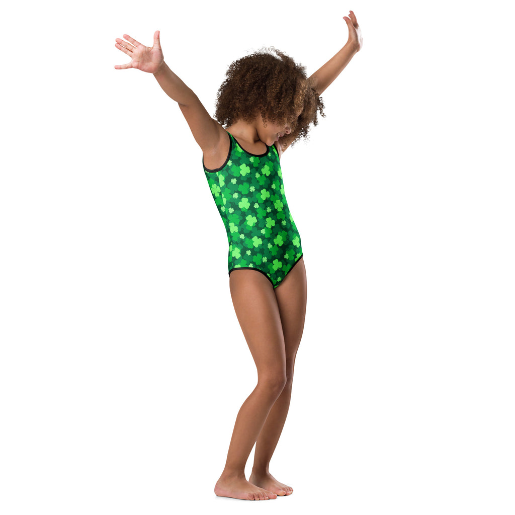 Girls St. Patrick’s Day green one-piece leotard with black trim and shamrock pattern made from buttery soft quick drying fabric