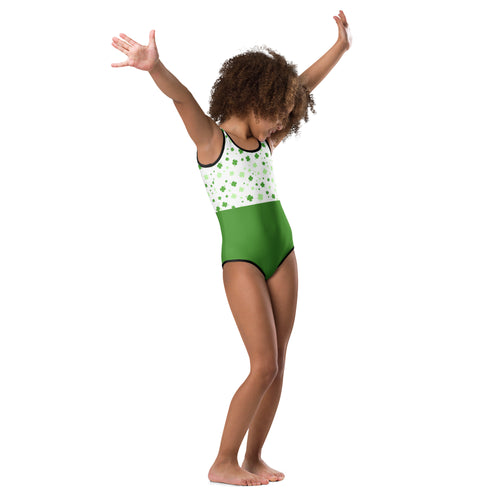 A child wearing a girls green lucky clover buttery soft quick drying leotard with shamrock patterns for dance and gymnastics