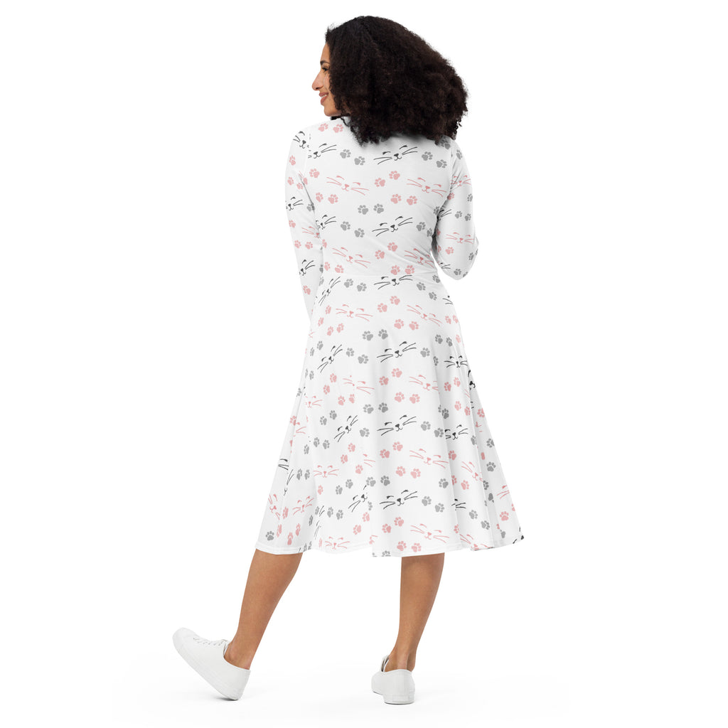 Women’s white long sleeve a-line midi dress with black pink and gray cat face and paw print pattern and pockets