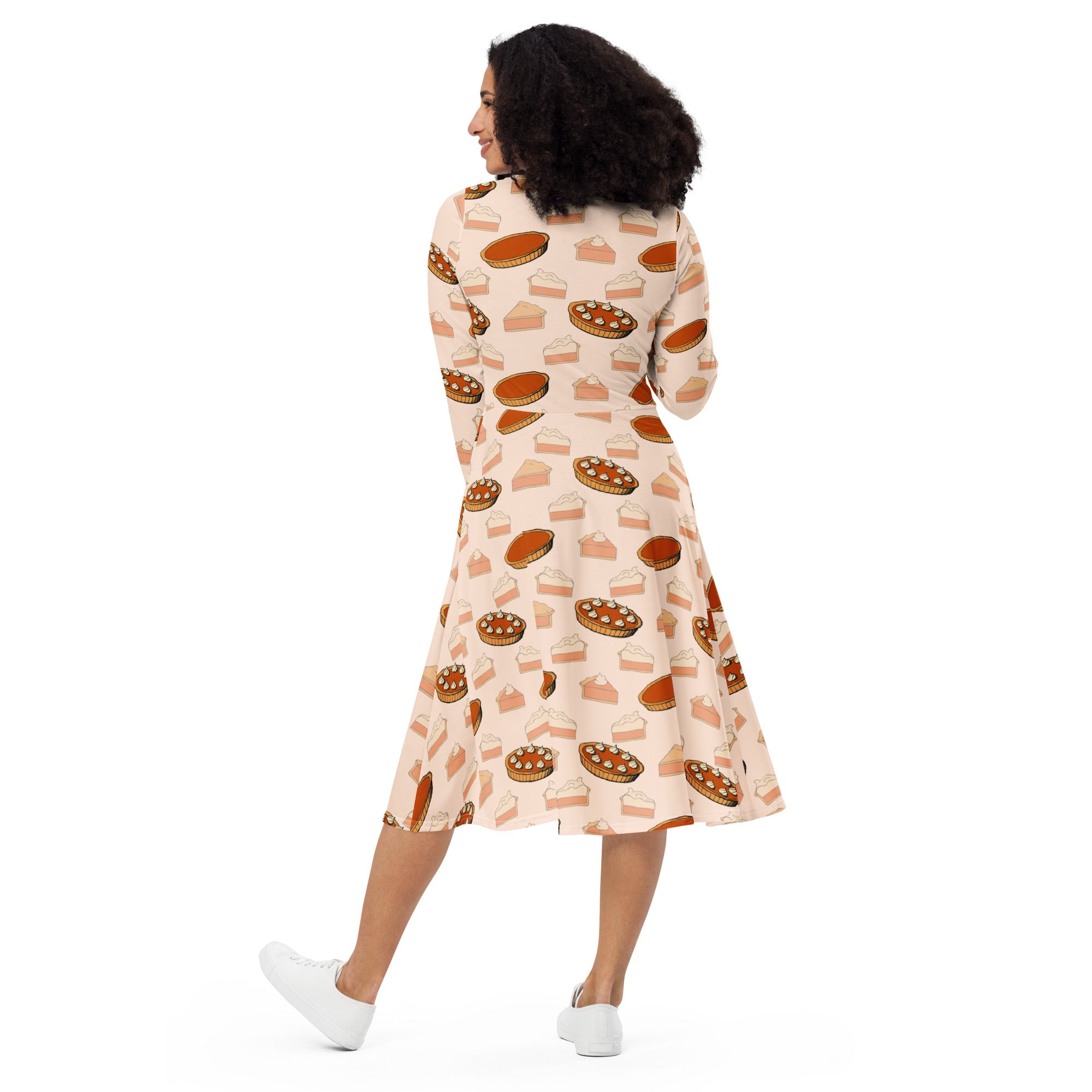 Women’s peach long sleeve a-line midi dress with playful pumpkin pie print and pockets for thanksgiving wear