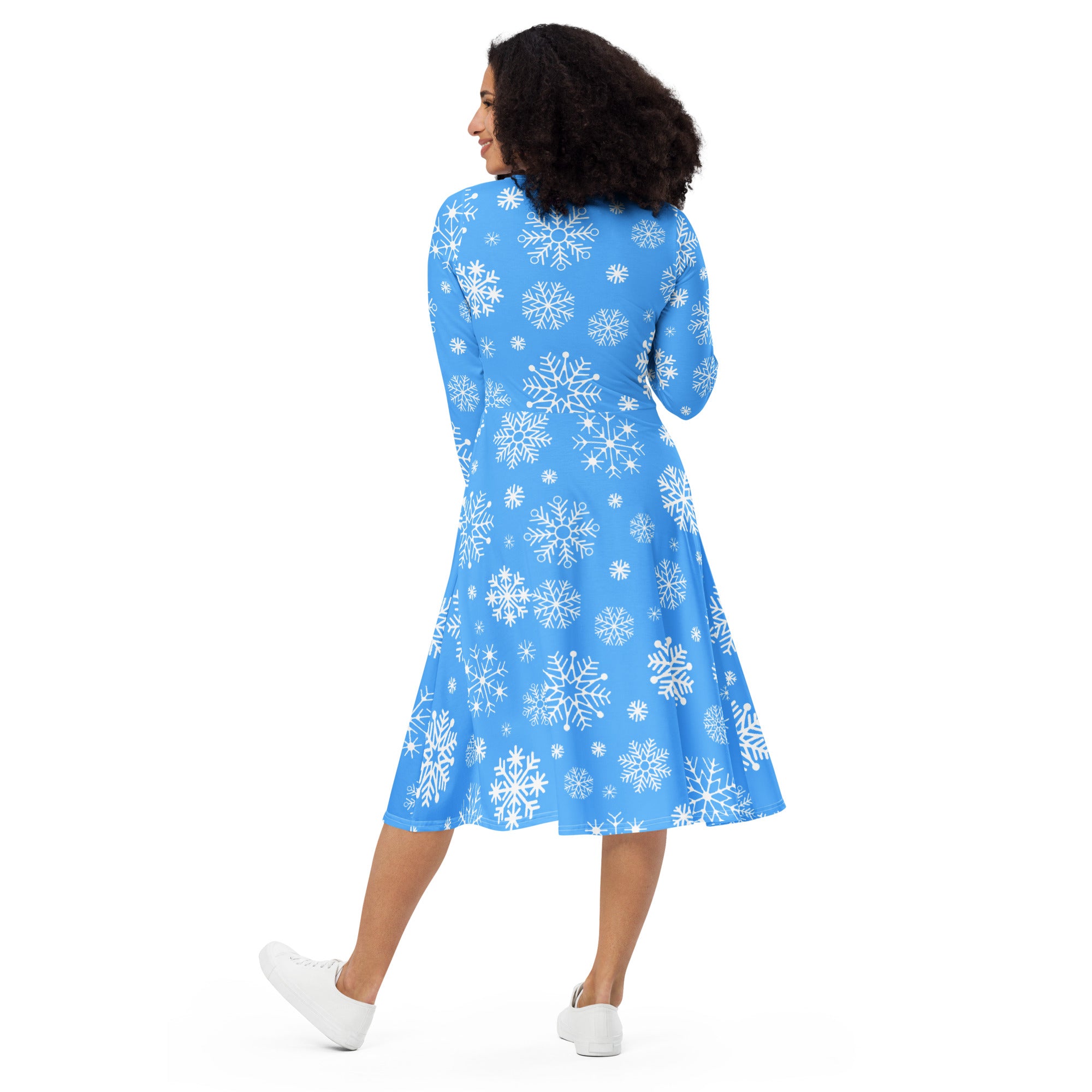 Women’s blue a-line midi dress with long sleeves high neckline and white snowflake pattern with pockets