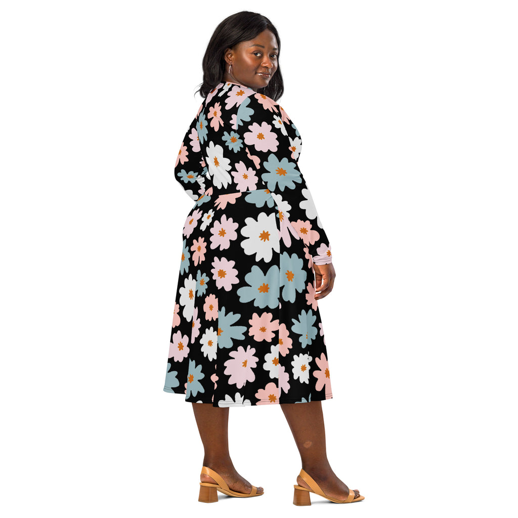 A black wrap dress with vibrant pink white and light blue floral pattern long sleeves midi length with pockets