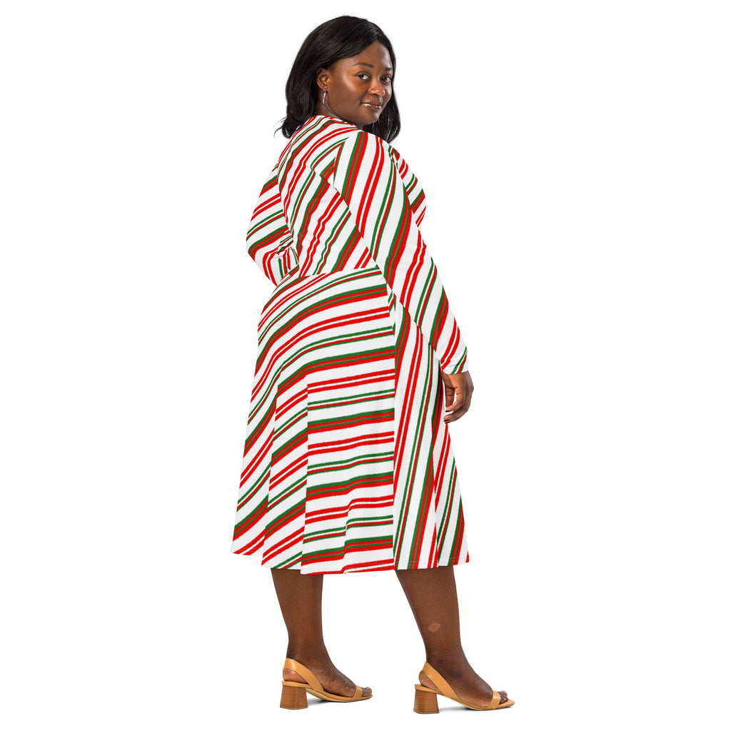 A plus-size woman wears a festive women’s candy cane stripe long sleeve midi dress with pockets in red green and white