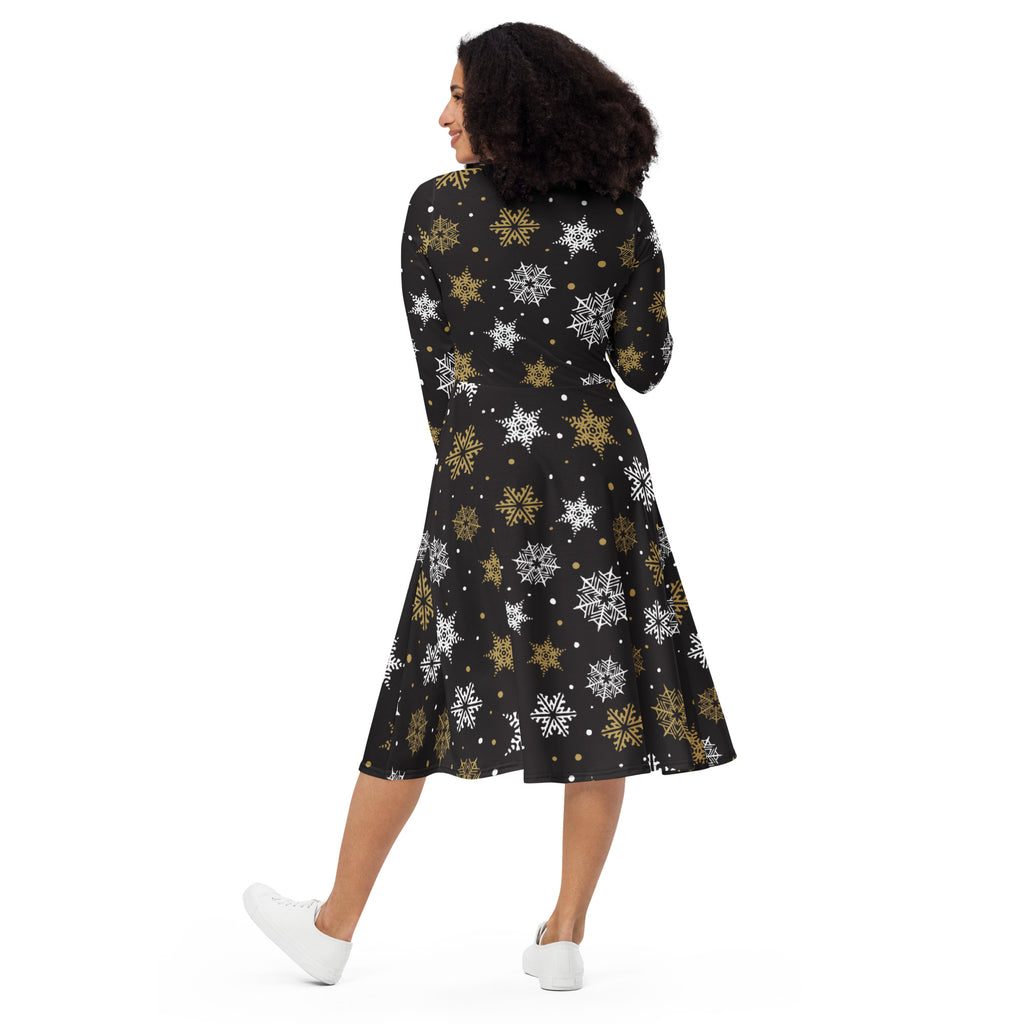 Women’s black a-line midi dress with high neckline three-quarter sleeves and white gold snowflake pattern with pockets