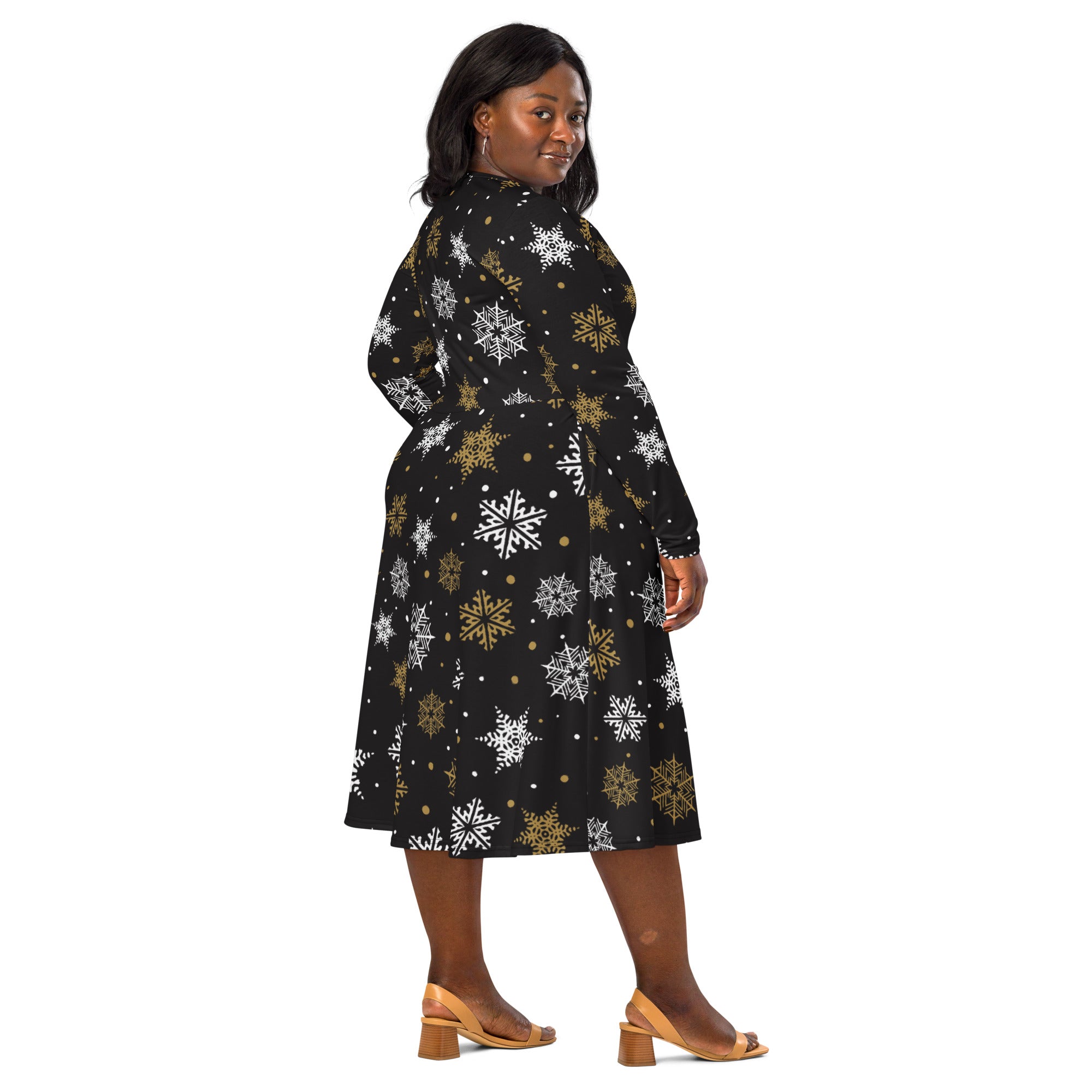 Women’s black long sleeve midi dress with white and gold snowflake pattern and pockets for winter wear