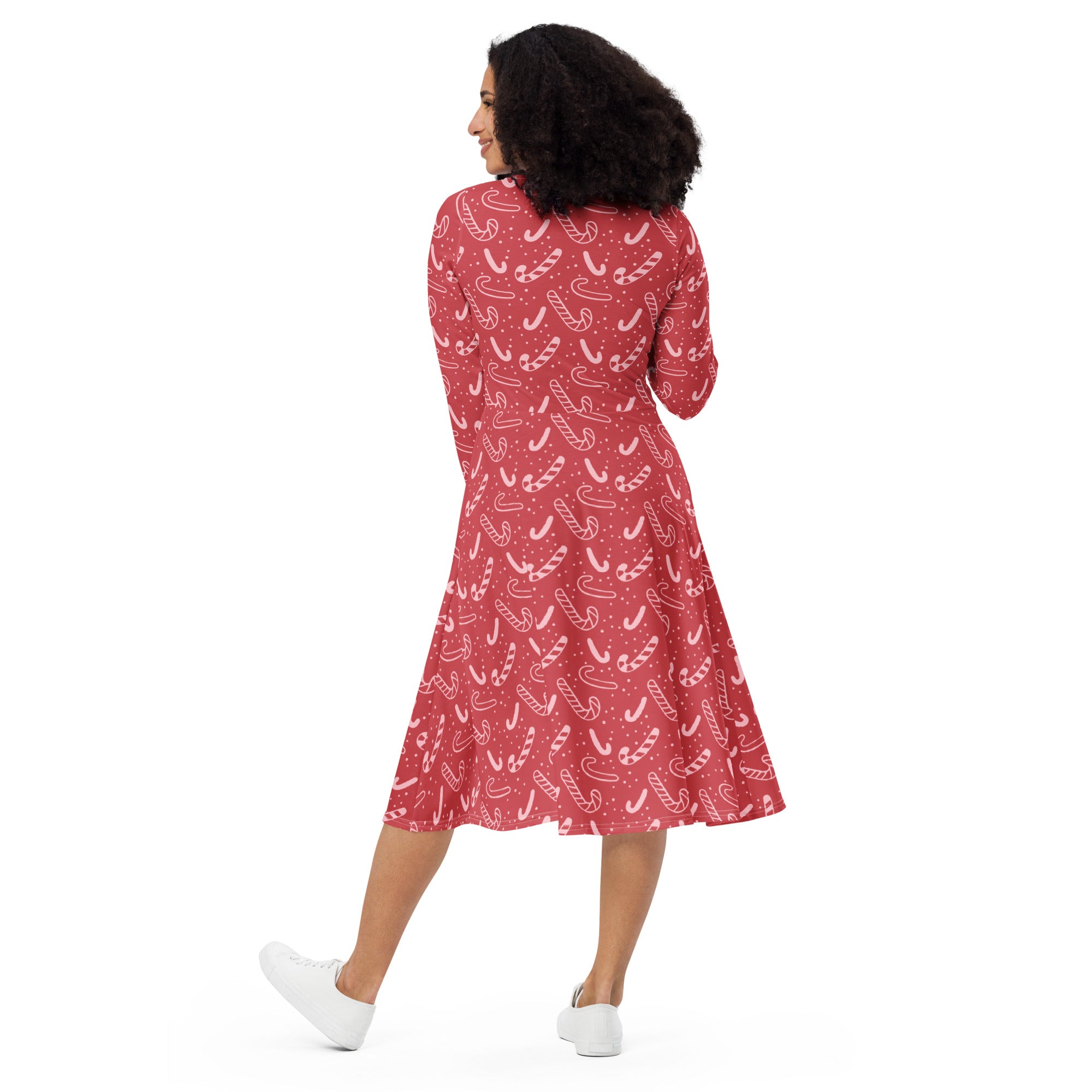 Women’s red candy cane pattern a-line midi dress with long sleeves flared skirt and pockets for christmas wear