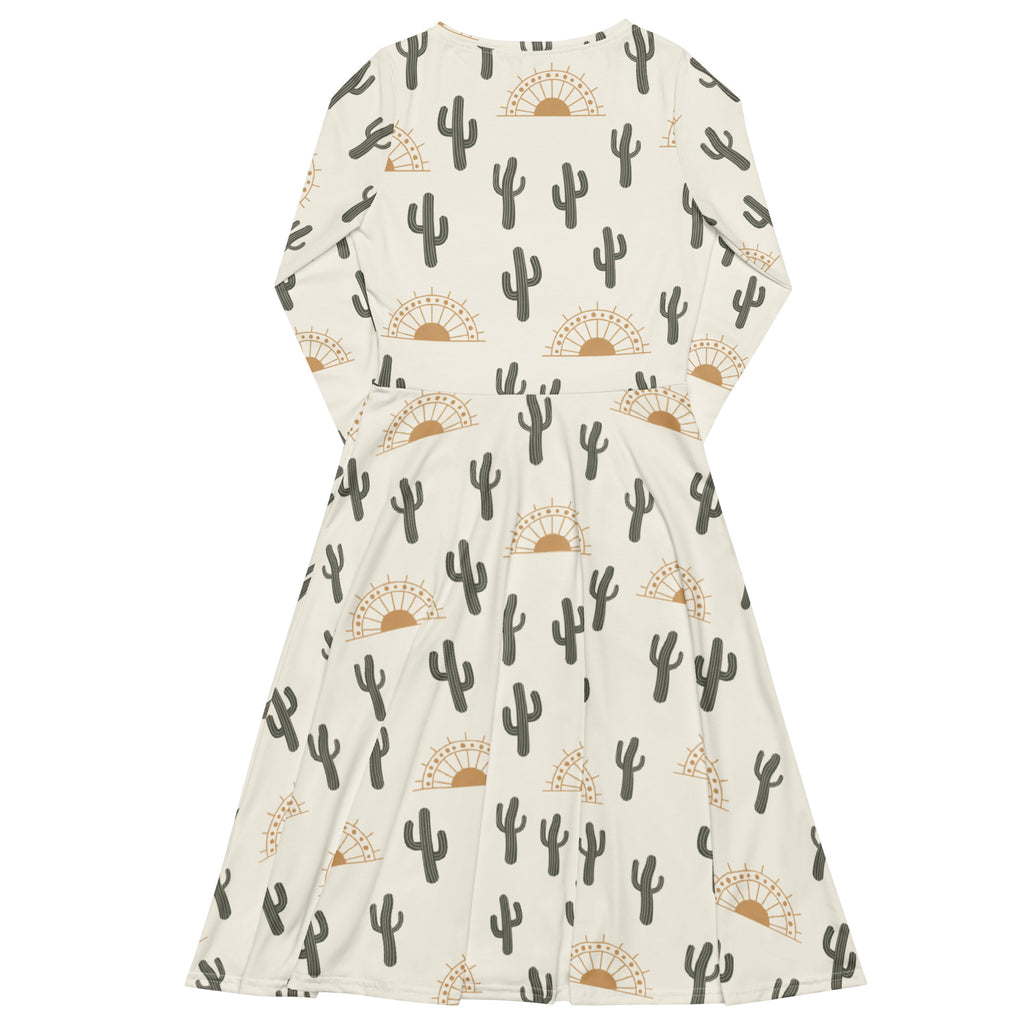 Cream-colored women’s midi dress with long sleeves, pockets, black cactus and golden sunset pattern