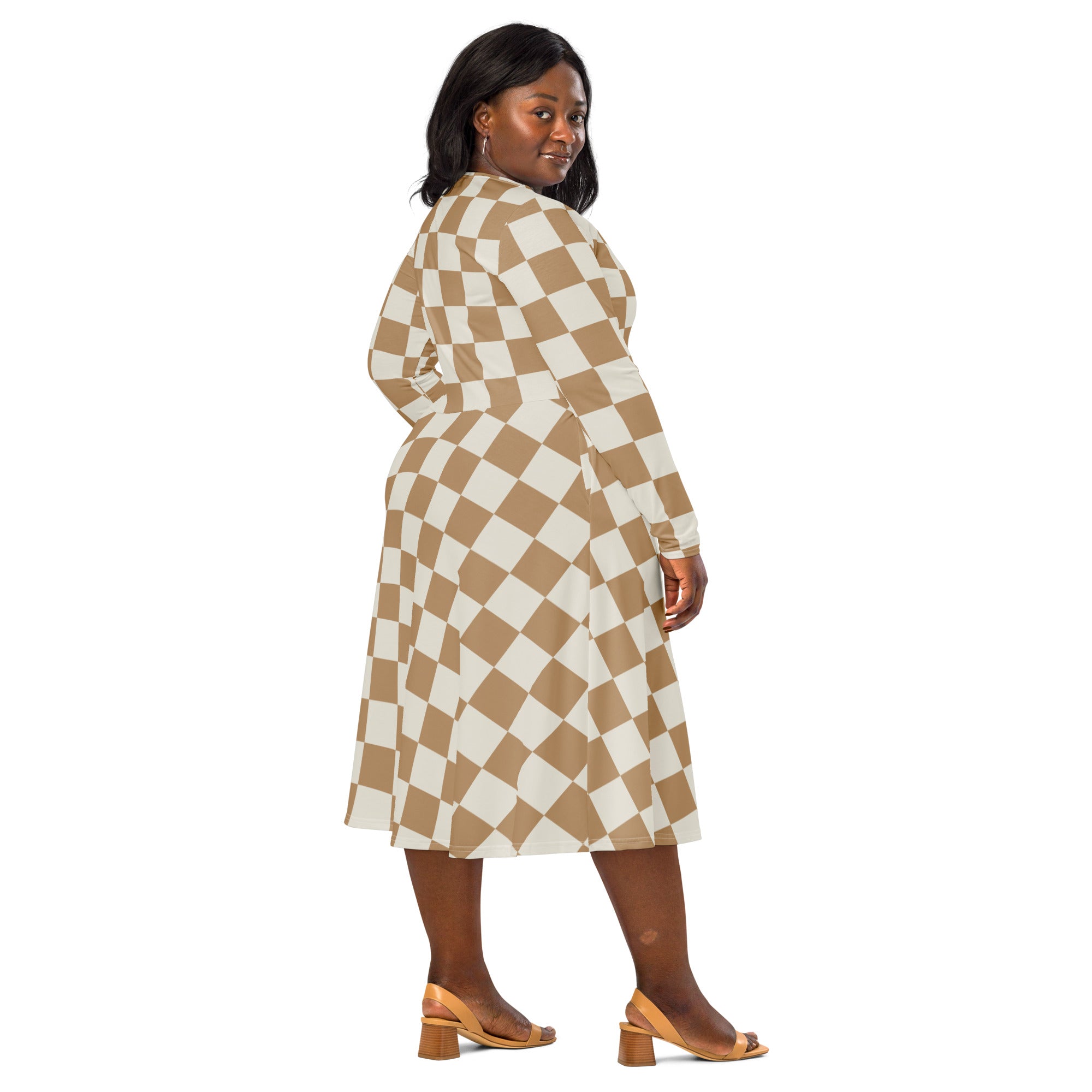 A plus-size woman wears a tan checkerboard long sleeve midi wrap dress with pockets in beige and cream tones
