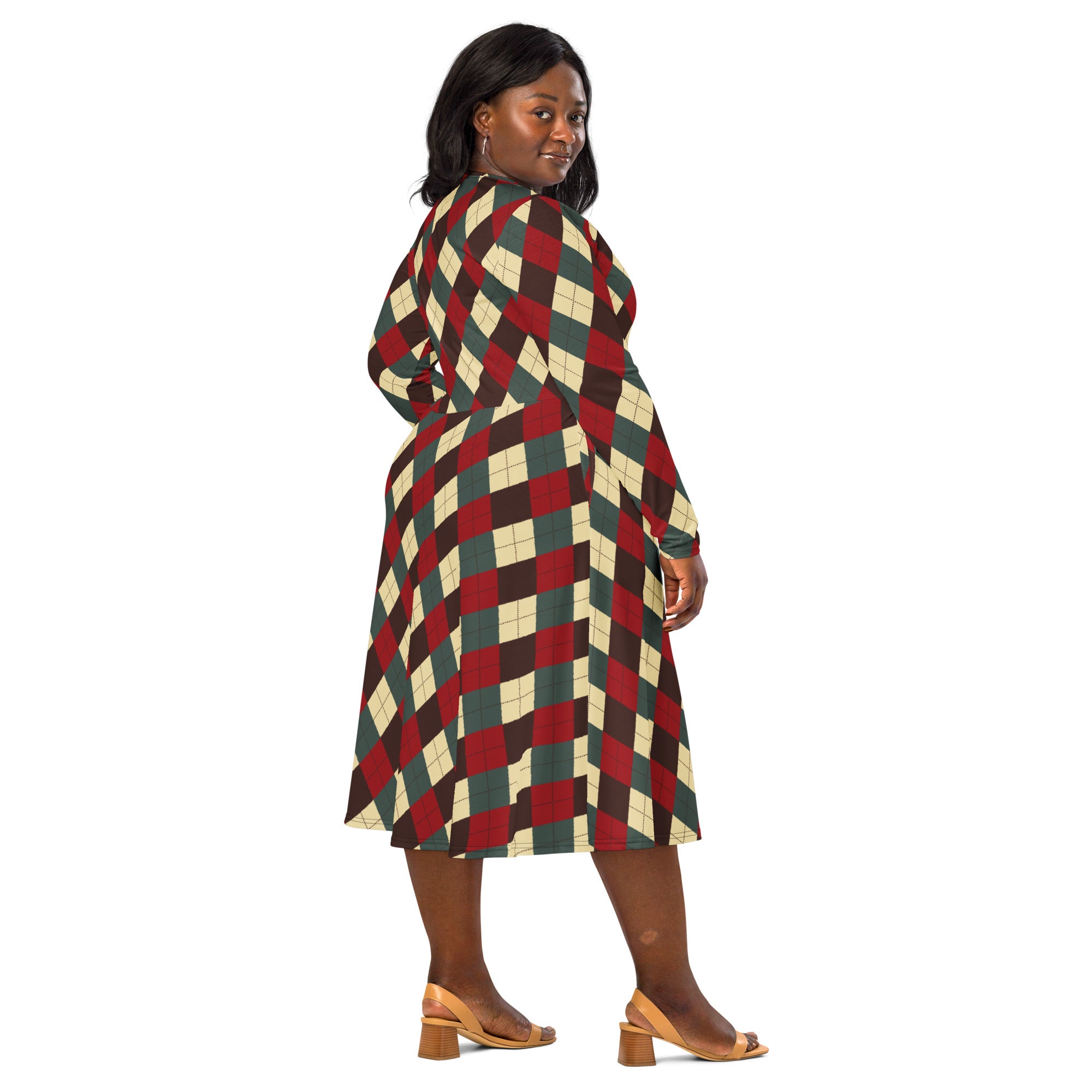 A plus-size woman wearing a long-sleeve red beige and dark green argyle midi dress with pockets for christmas