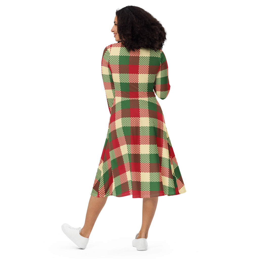 A woman wears a women’s Christmas plaid long sleeve midi dress with pockets in red green and cream festive colors