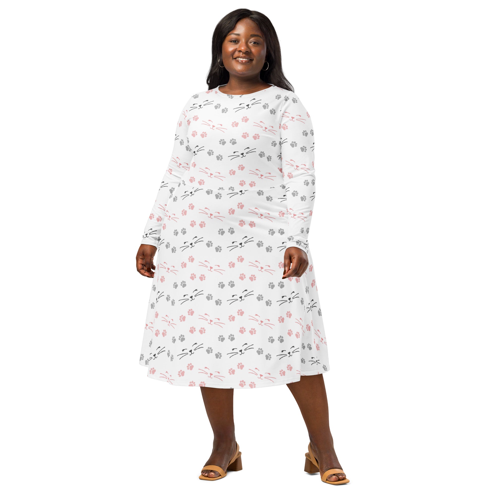 Women’s white long sleeve midi dress with pink and gray cat face pattern and pockets