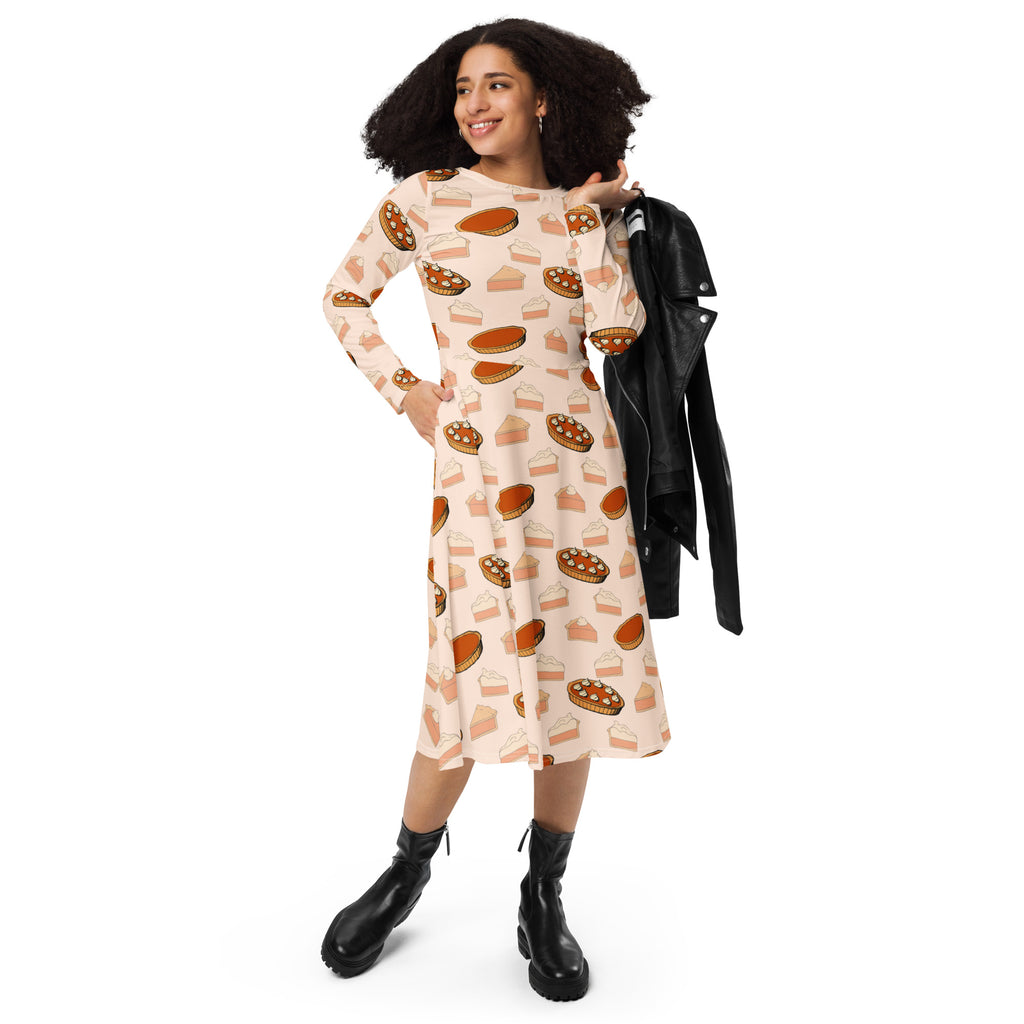 Women’s long-sleeved midi dress in soft beige fabric with playful pumpkin pie print and convenient pockets for thanksgiving