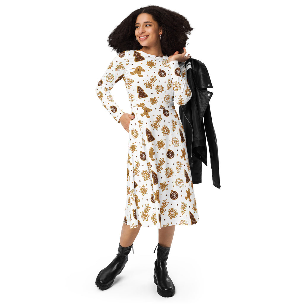 A festive white midi dress with long sleeves and pockets featuring golden gingerbread men stars and cookies pattern