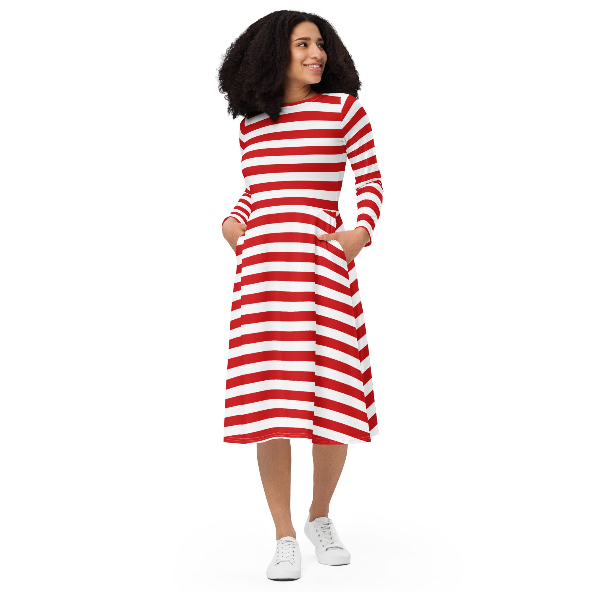 A woman wearing a red and white striped long sleeve midi dress with side pockets showing the front view