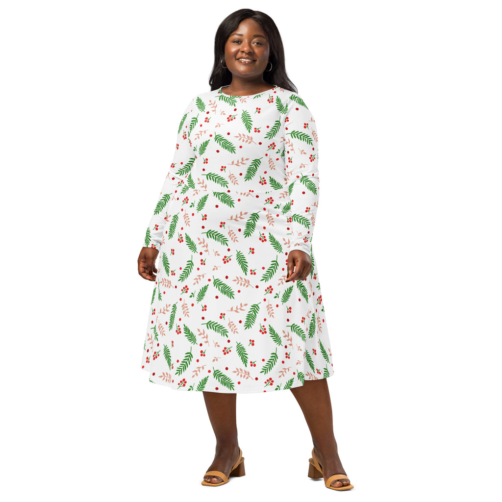 A plus-size woman wears a white long sleeve midi dress with green leaf and red berry holly print and pockets