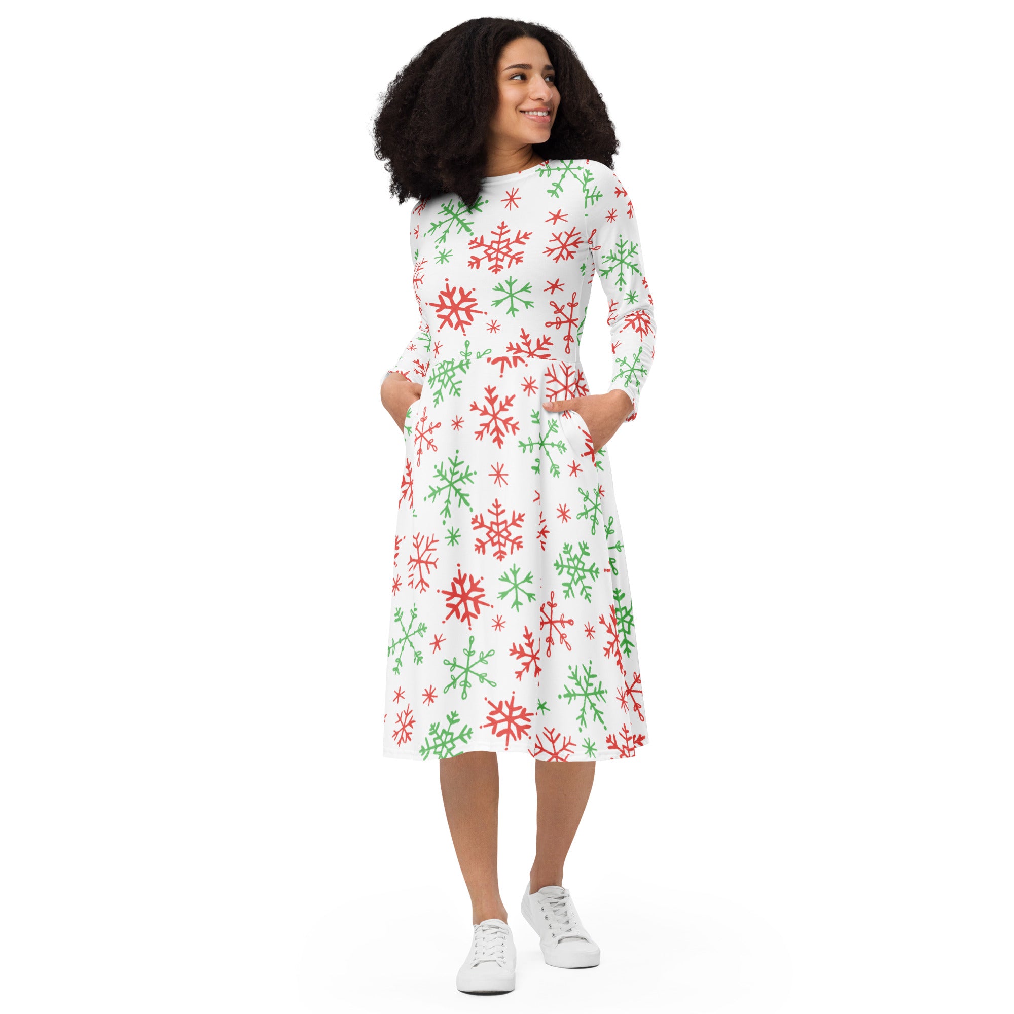A festive white midi dress with red and green snowflake pattern long sleeves and side pockets for Christmas wear