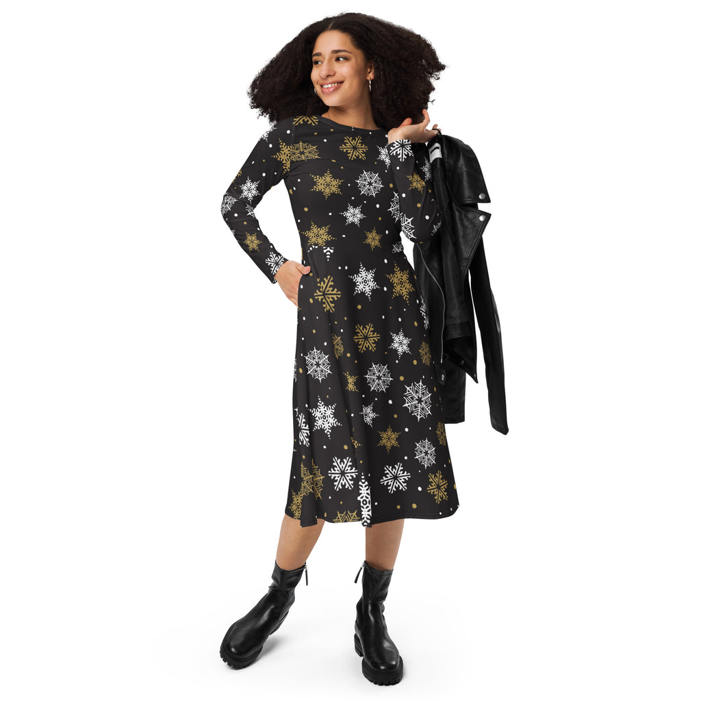Black long sleeve midi dress with gold and white snowflake pattern and pockets perfect for festive occasions